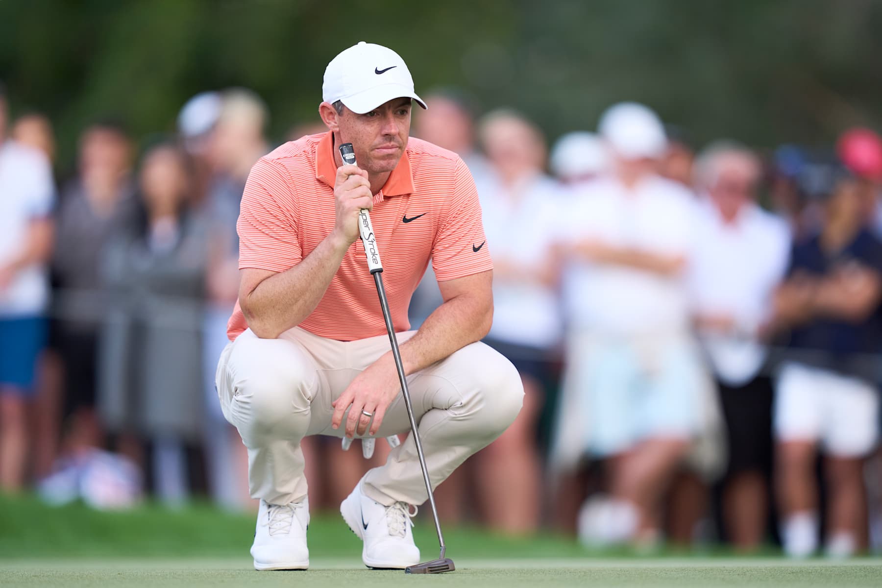 DUBAI, UNITED ARAB EMIRATES - JANUARY 19: Rory McIlroy of Northern Ireland studies a putt on the 17th hole during the final round of the Hero Dubai Desert Classic at Emirates Golf Club on January 19, 2025 in Dubai, United Arab Emirates. (Photo by Pedro Salado/Getty Images)