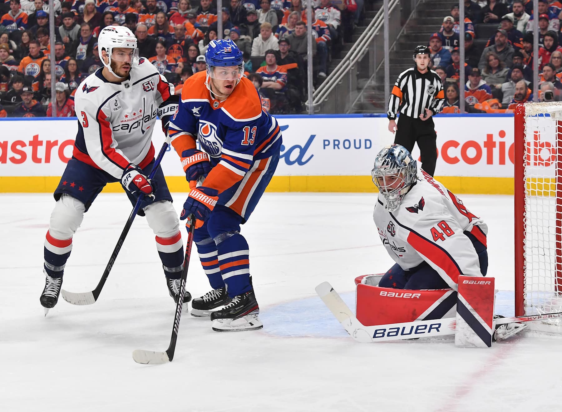 EDMONTON, CANADA - JANUARY 21: Logan Thompson #48 of the Washington Capitals makes a save as teammate Matt Roy #3 and Mattias Janmark #13 of the Edmonton Oilers search for the rebound during the first period of the game at Rogers Place on January 21, 2025, in Edmonton, Alberta, Canada. (Photo by Andy Devlin/NHLI via Getty Images)