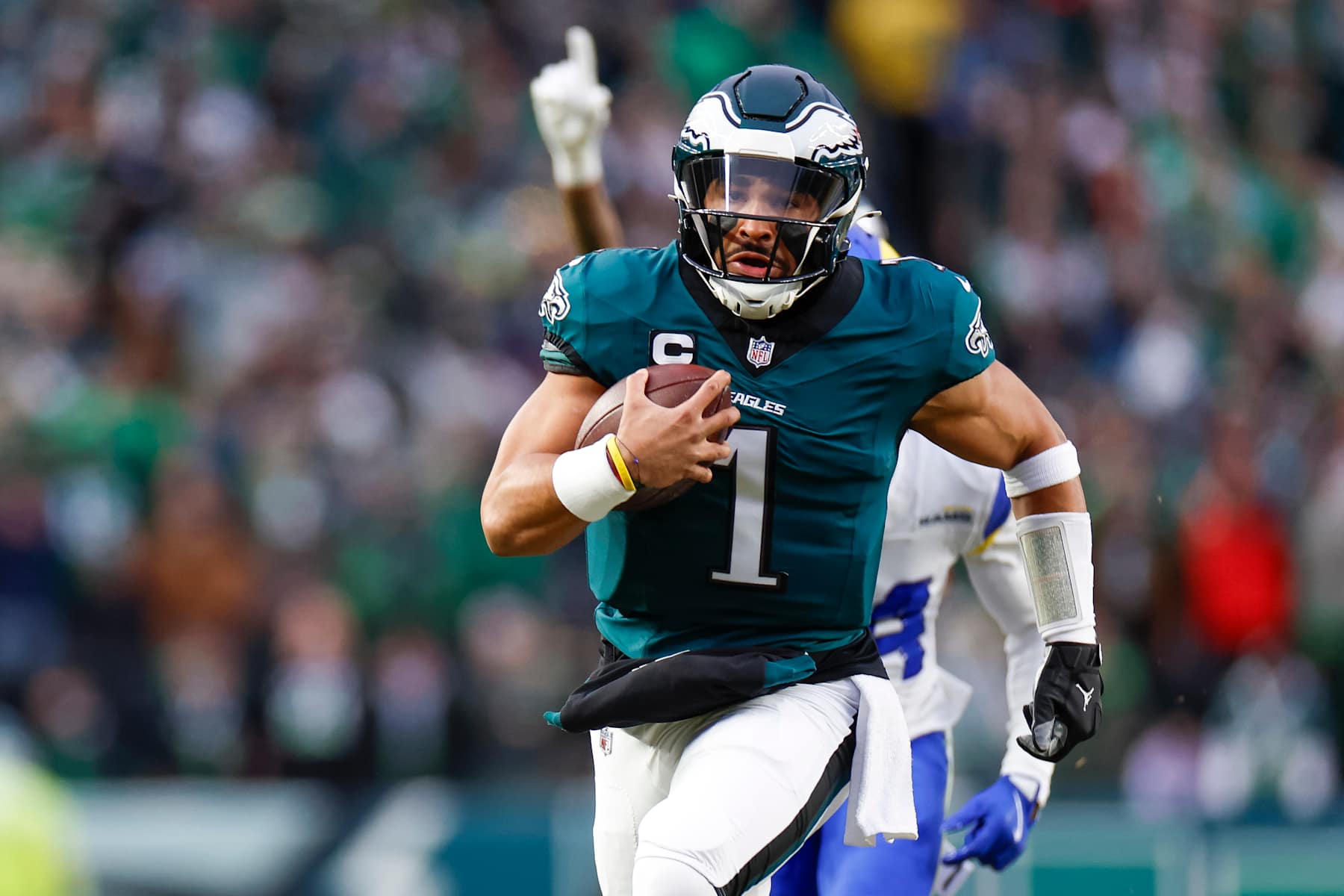PHILADELPHIA, PENNSYLVANIA - JANUARY 19: Jalen Hurts #1 of the Philadelphia Eagles runs for a touchdown in the first quarter during the NFC Divisional Playoff game against the Los Angeles Rams at Lincoln Financial Field on January 19, 2025 in Philadelphia, Pennsylvania. (Photo by Brandon Sloter/Getty Images)