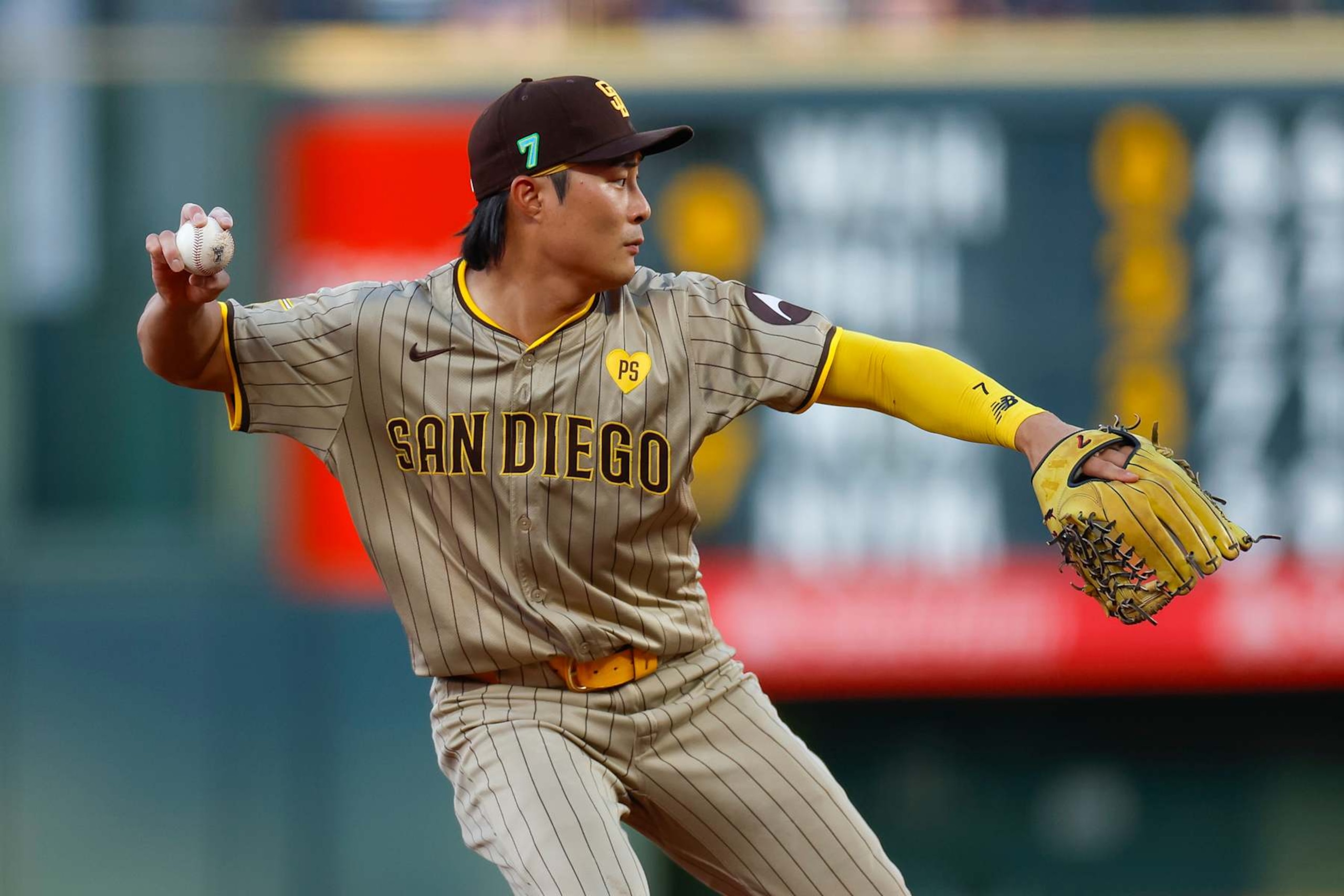 DENVER, COLORADO - AUGUST 16: Ha-Seong Kim #7 of the San Diego Padres throws to first base for an out in the second inning during a game against the Colorado Rockies at Coors Field on August 16, 2024 in Denver, Colorado. (Photo by Brandon Sloter/Image Of Sport/Getty Images)