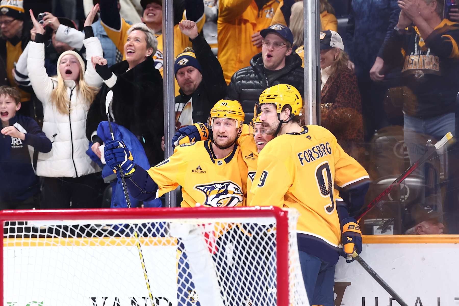 NASHVILLE, TENNESSEE - JANUARY 21:  Filip Forsberg #9 of the Nashville Predators and Steven Stamkos #91 celebrate a goal by Jonathan Marchessault #81 in the second period agains the San Jose Sharks on January 21, 2025 at Bridgestone Arena in Nashville. (Photo by Casey Gower/NHLI via Getty Images)