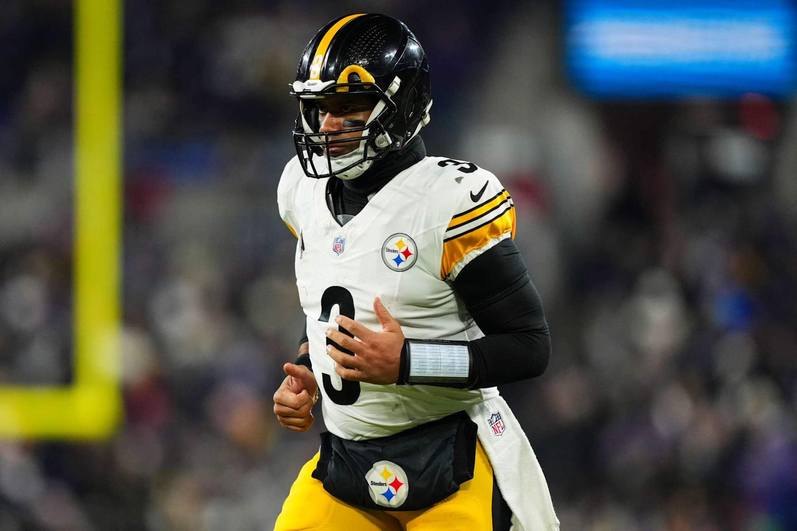 BALTIMORE, MD - JANUARY 11: Russell Wilson #3 of the Pittsburgh Steelers runs across the field during an NFL football wild card playoff game against the Baltimore Ravens at M&T Bank Stadium on January 11, 2025 in Baltimore, Maryland. (Photo by Cooper Neill/Getty Images) BALTIMORE, MD - JANUARY 11: Russell Wilson #3 of the Pittsburgh Steelers runs across the field during an NFL football wild card playoff game against the Baltimore Ravens at M&T Bank Stadium on January 11, 2025 in Baltimore, Maryland. (Photo by Cooper Neill/Getty Images)
