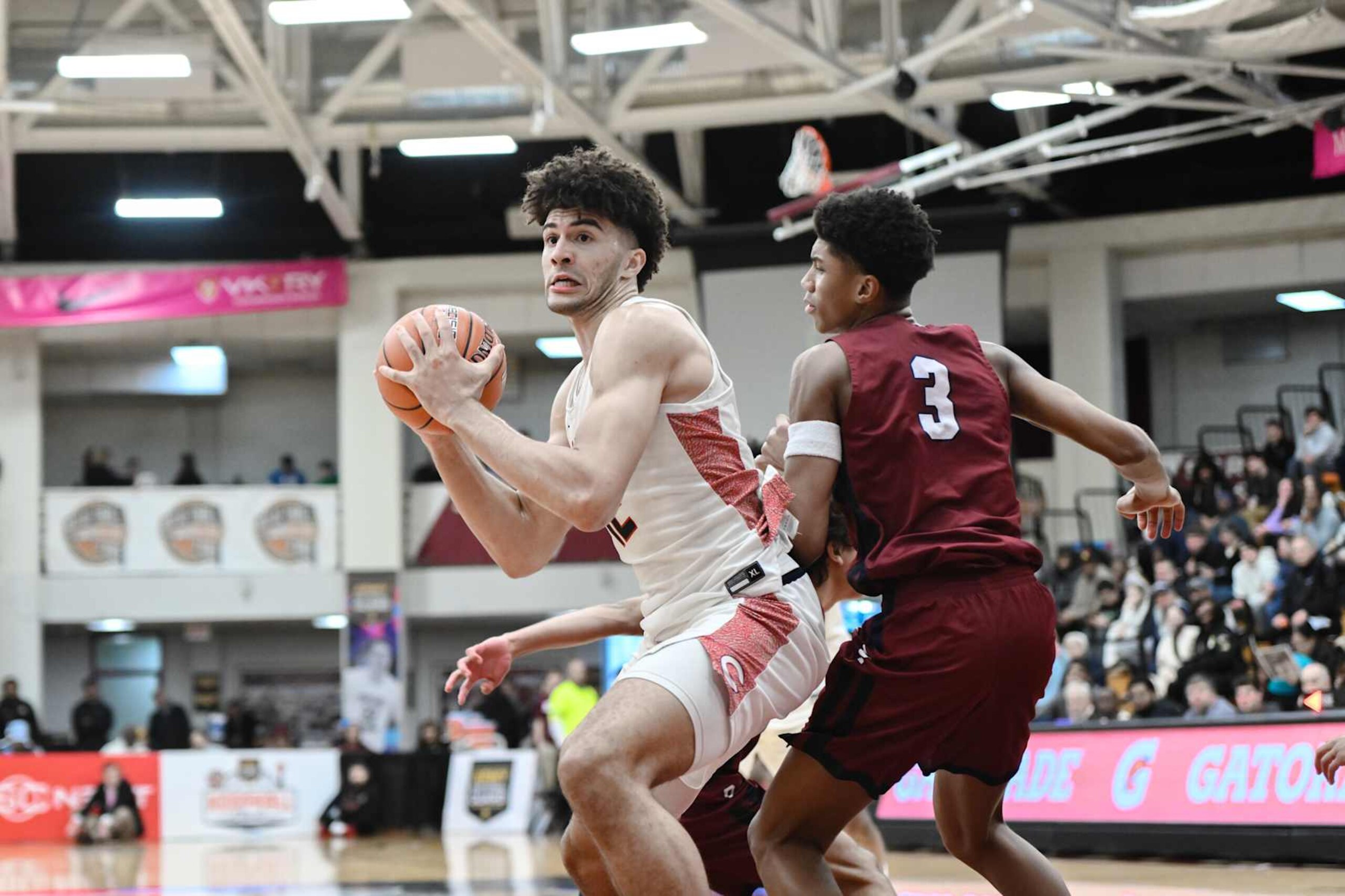 SPRINGFIELD, MA - JANUARY 20: Cameron Boozer of Christopher Columbus (12) drives past Bruce Branch III of Perry (3) during the Spalding Hoophall Classic high school basketball game between Columbus and Perry on January 20, 2025 at Blake Arena in Springfield, MA (Photo by John Jones/Icon Sportswire via Getty Images) SPRINGFIELD, MA - JANUARY 20: Cameron Boozer of Christopher Columbus (12) drives past Bruce Branch III of Perry (3) during the Spalding Hoophall Classic high school basketball game between Columbus and Perry on January 20, 2025 at Blake Arena in Springfield, MA (Photo by John Jones/Icon Sportswire via Getty Images)