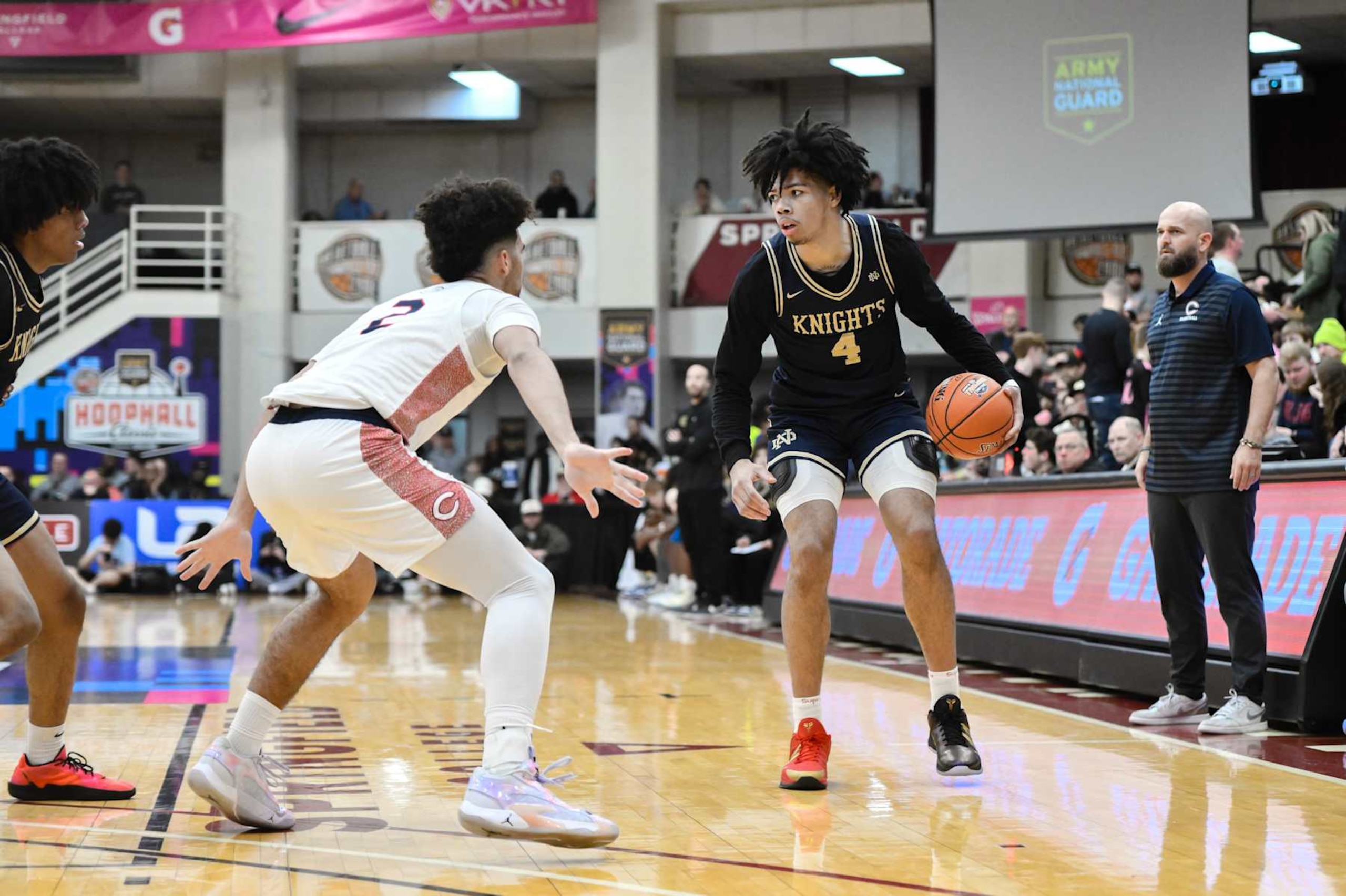 SPRINGFIELD, MA - JANUARY 18: Tyran Stokes of Notre Dame (4) sets the play while being defended by Cayden Boozer of Christopher Columbus (2) during the Spalding Hoophall Classic high school basketball game between Columbus and Notre Dame on January 18, 2025 at Blake Arena in Springfield, MA (Photo by John Jones/Icon Sportswire via Getty Images) SPRINGFIELD, MA - JANUARY 18: Tyran Stokes of Notre Dame (4) sets the play while being defended by Cayden Boozer of Christopher Columbus (2) during the Spalding Hoophall Classic high school basketball game between Columbus and Notre Dame on January 18, 2025 at Blake Arena in Springfield, MA (Photo by John Jones/Icon Sportswire via Getty Images)