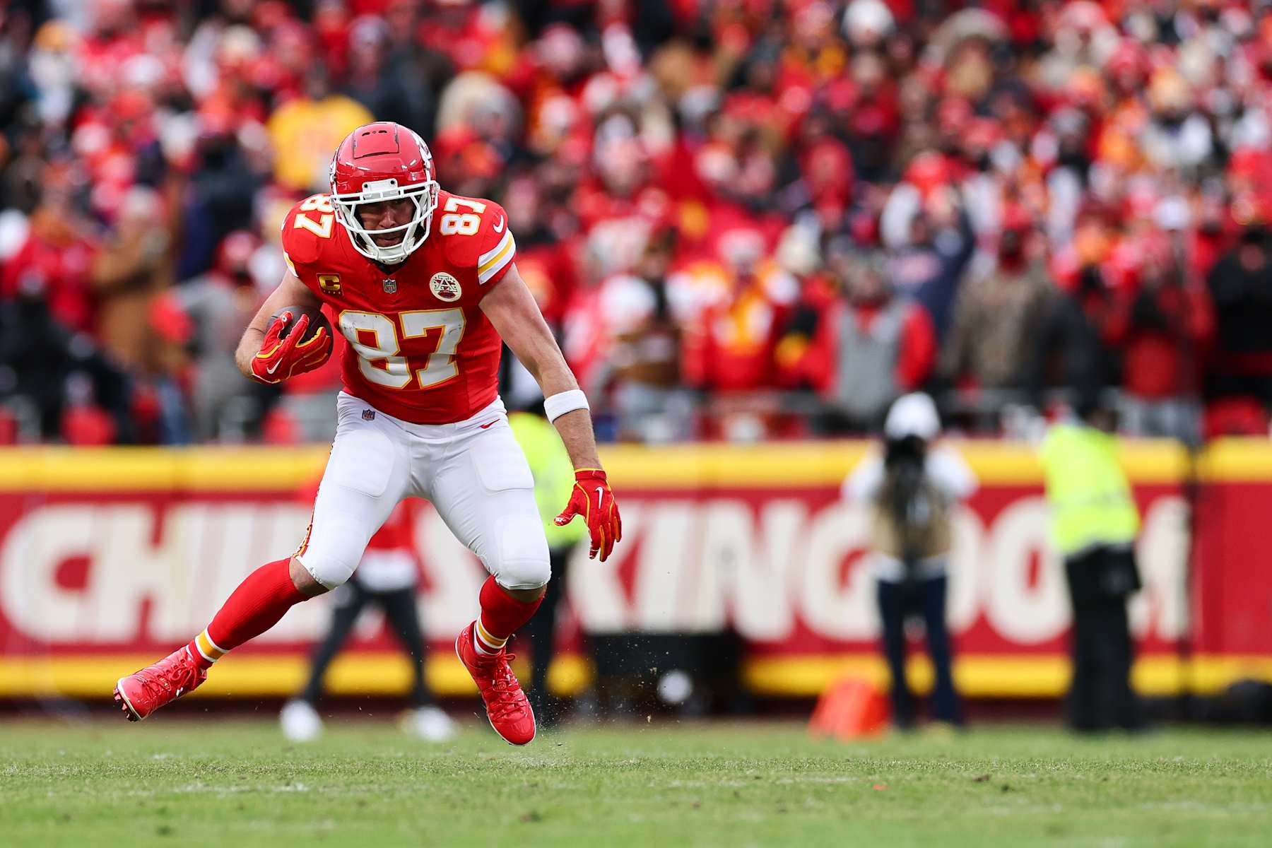 KANSAS CITY, MISSOURI - JANUARY 18: Travis Kelce #87 of the Kansas City Chiefs runs after the catch during the first half of the AFC Divisional playoff game against the Houston Texans at GEHA Field at Arrowhead Stadium on January 18, 2025 in Kansas City, Missouri. (Photo by Aaron M. Sprecher/Getty Images)