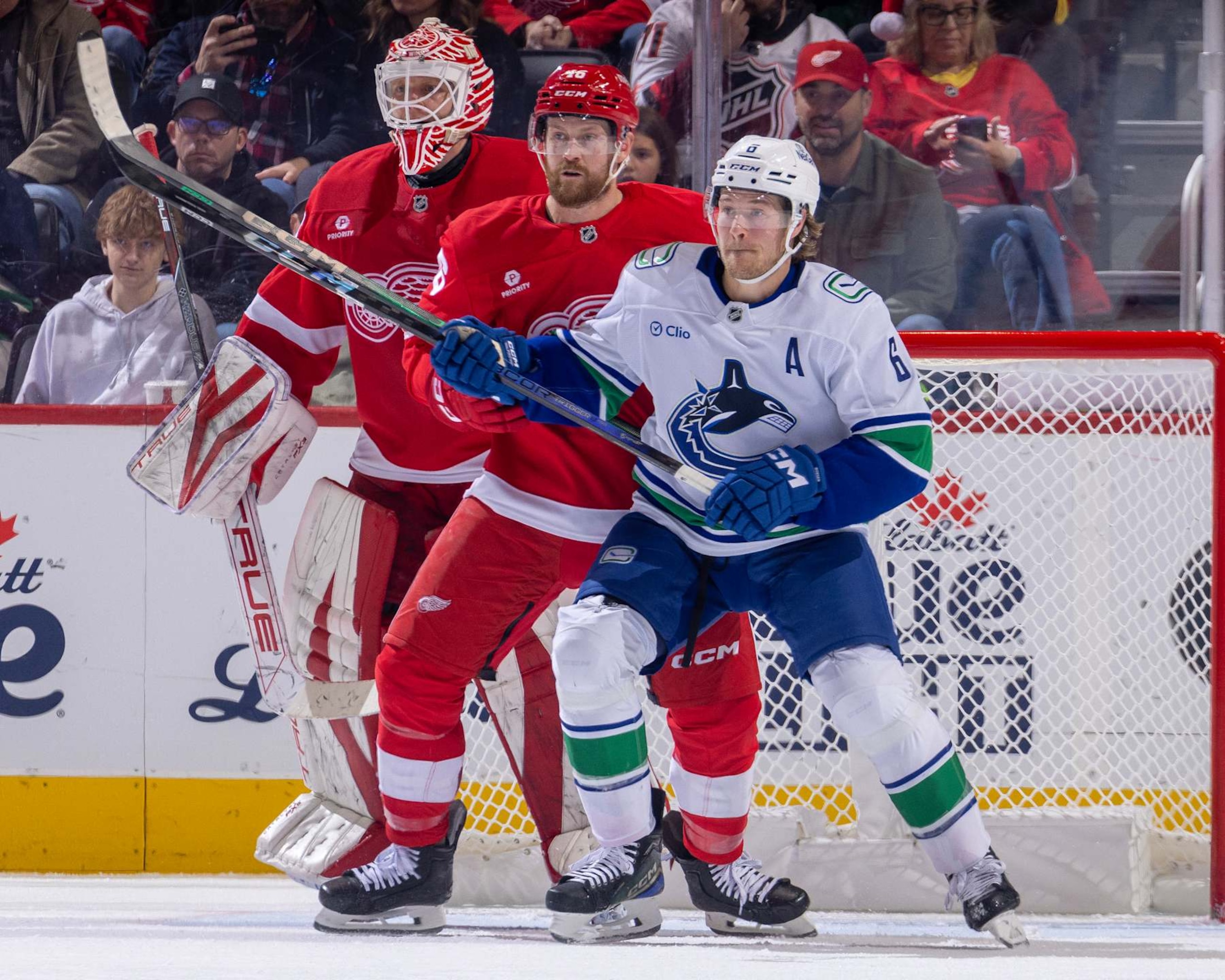 DETROIT, MICHIGAN - DECEMBER 01: Ville Husso #35 of the Detroit Red Wings follows the play as Jeff Petry #46 defends against Brock Boeser #6 of the Vancouver Canucks during the third period at Little Caesars Arena on December 1, 2024 in Detroit, Michigan. Vancouver defeated Detroit 5-4 in O.T. (Photo by Dave Reginek/NHLI via Getty Images) DETROIT, MICHIGAN - DECEMBER 01: Ville Husso #35 of the Detroit Red Wings follows the play as Jeff Petry #46 defends against Brock Boeser #6 of the Vancouver Canucks during the third period at Little Caesars Arena on December 1, 2024 in Detroit, Michigan. Vancouver defeated Detroit 5-4 in O.T. (Photo by Dave Reginek/NHLI via Getty Images)