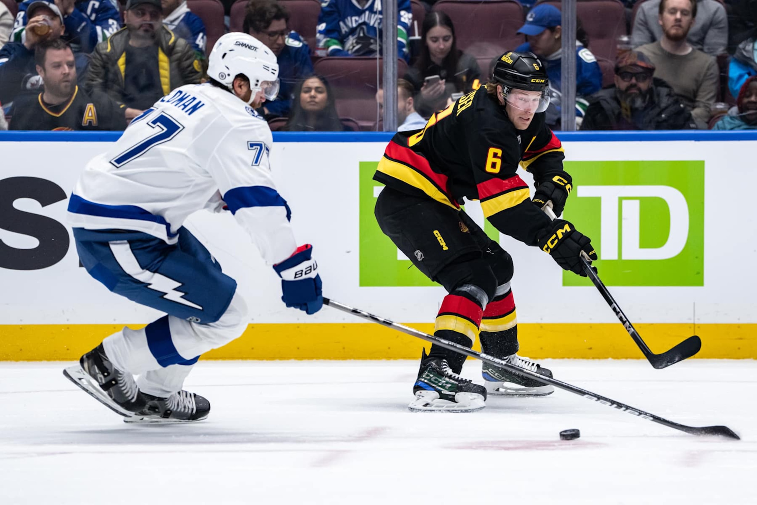 VANCOUVER, BC - DECEMBER 08: Vancouver Canucks right wing Brock Boeser (6) and Tampa Bay Lightning defenseman Victor Hedman (77) vie for the puck during the first period of an NHL game between the Tampa Bay Lightning and the Vancouver Canucks on Sunday, December 8, 2024 at Rogers Arena in Vancouver, B.C. (Photo by Ethan Cairns/Icon Sportswire via Getty Images) VANCOUVER, BC - DECEMBER 08: Vancouver Canucks right wing Brock Boeser (6) and Tampa Bay Lightning defenseman Victor Hedman (77) vie for the puck during the first period of an NHL game between the Tampa Bay Lightning and the Vancouver Canucks on Sunday, December 8, 2024 at Rogers Arena in Vancouver, B.C. (Photo by Ethan Cairns/Icon Sportswire via Getty Images)