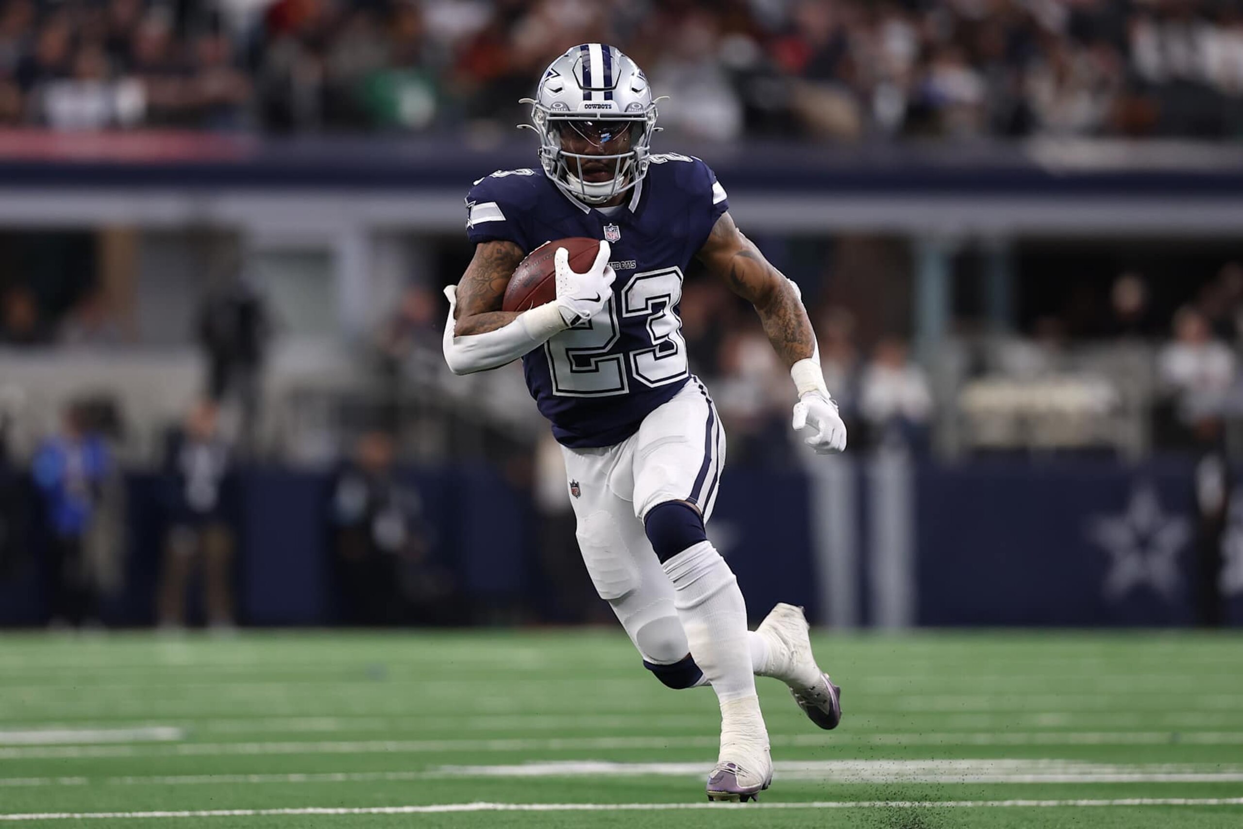 ARLINGTON, TEXAS - JANUARY 05: Rico Dowdle #23 of the Dallas Cowboys runs with the ball during the second quarter against the Washington Commanders at AT&T Stadium on January 05, 2025 in Arlington, Texas. (Photo by Sam Hodde/Getty Images) ARLINGTON, TEXAS - JANUARY 05: Rico Dowdle #23 of the Dallas Cowboys runs with the ball during the second quarter against the Washington Commanders at AT&T Stadium on January 05, 2025 in Arlington, Texas. (Photo by Sam Hodde/Getty Images)
