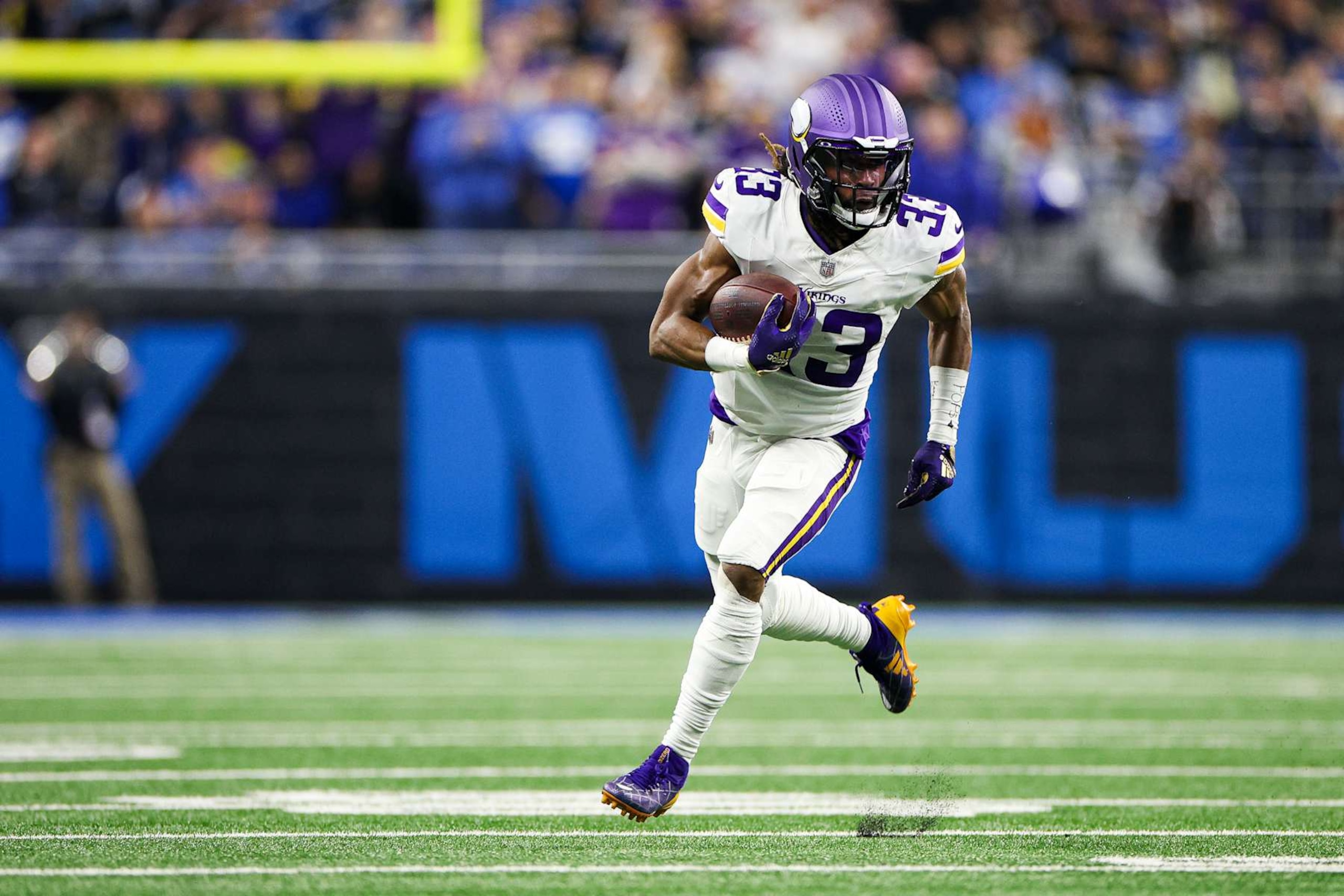 DETROIT, MICHIGAN - JANUARY 05: Aaron Jones #33 of the Minnesota Vikings runs the ball up the field in the second quarter of a game against the Detroit Lions at Ford Field on January 05, 2025 in Detroit, Michigan. (Photo by Mike Mulholland/Getty Images) DETROIT, MICHIGAN - JANUARY 05: Aaron Jones #33 of the Minnesota Vikings runs the ball up the field in the second quarter of a game against the Detroit Lions at Ford Field on January 05, 2025 in Detroit, Michigan. (Photo by Mike Mulholland/Getty Images)