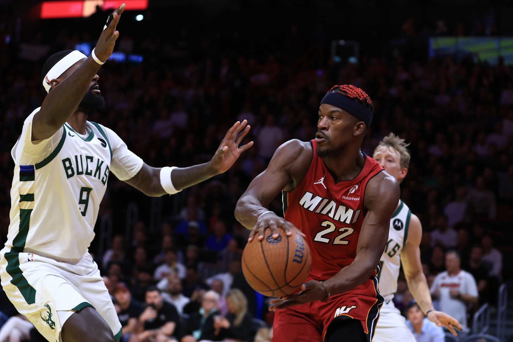 MIAMI, FLORIDA - NOVEMBER 26: Jimmy Butler #22 of the Miami Heat drives against Bobby Portis #9 of the Milwaukee Bucks during the third quarter of the Emirates NBA Cup at Kaseya Center on November 26, 2024 in Miami, Florida. NOTE TO USER: User expressly acknowledges and agrees that, by downloading and or using this photograph, User is consenting to the terms and conditions of the Getty Images License Agreement. (Photo by Megan Briggs/Getty Images)