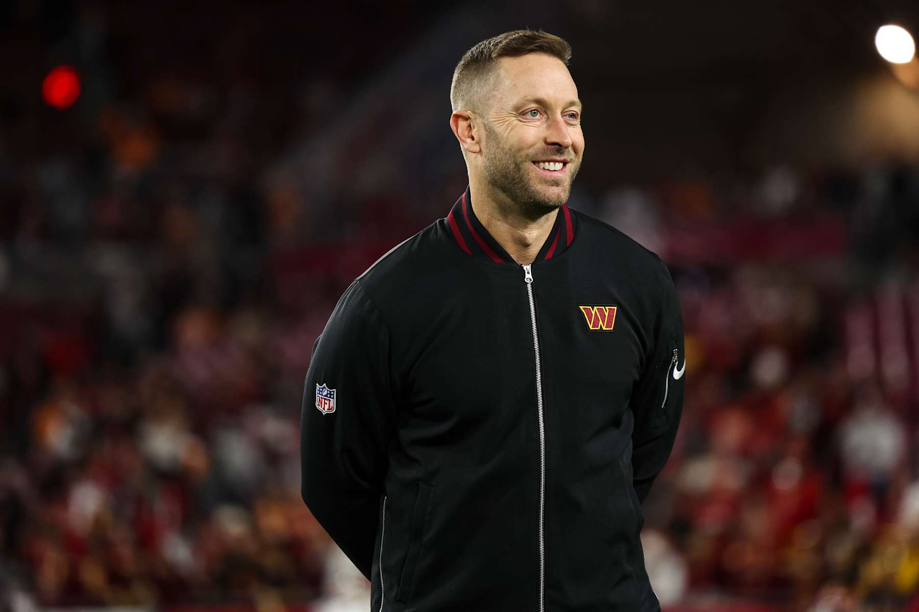 TAMPA, FLORIDA - JANUARY 12:  Washington Commanders offensive coordinator Kliff Kingsbury looks on from the field prior to an NFL football wild card playoff game against the Tampa Bay Buccaneers at Raymond James Stadium on January 12, 2025 in Tampa, Florida. (Photo by Perry Knotts/Getty Images)