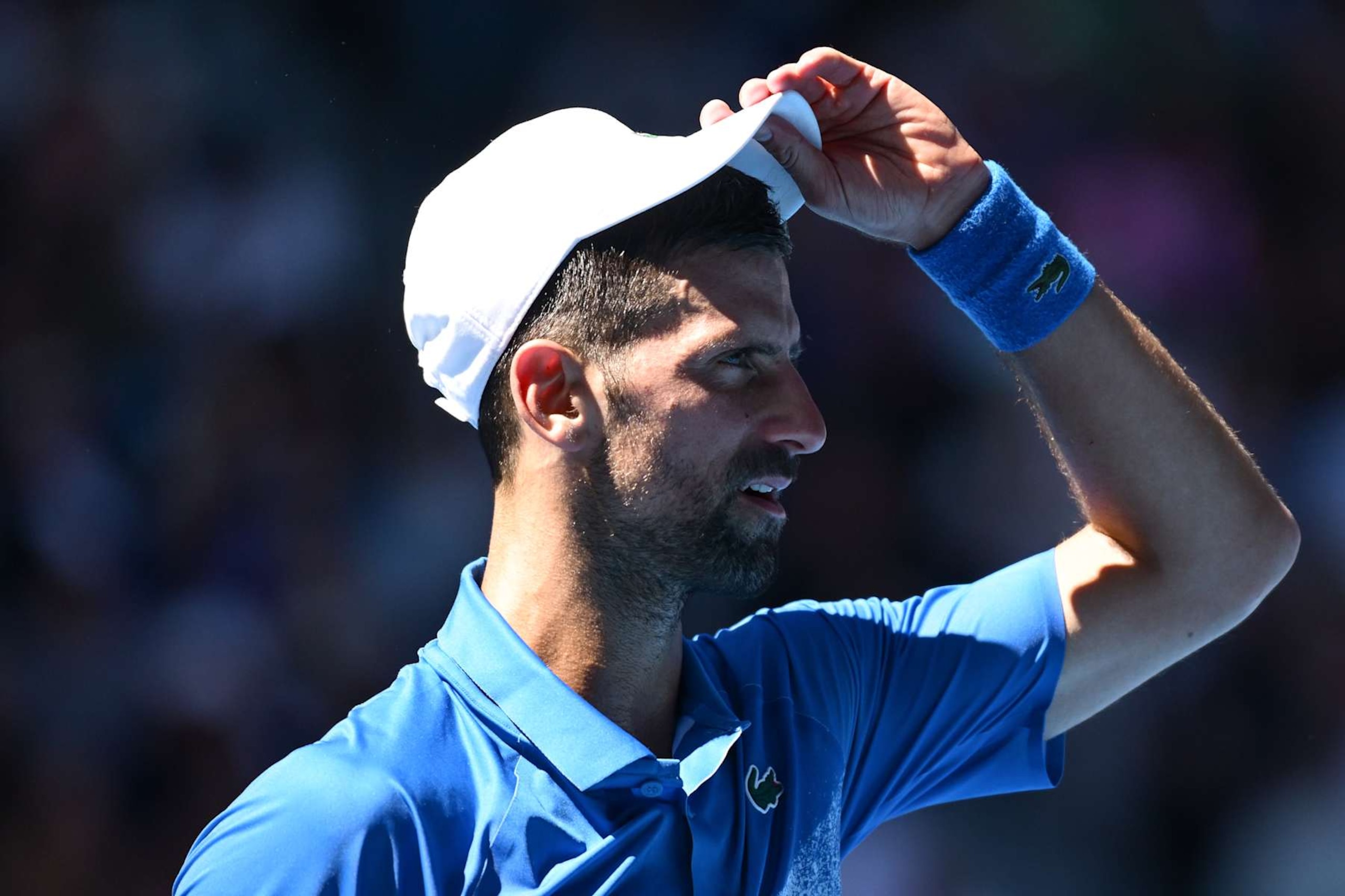 MELBOURNE, AUSTRALIA - JANUARY 24: Novak Djokovic of Serbia reacts in the Men's Singles Semifinal against Alexander Zverev of Germany during day 13 of the 2025 Australian Open at Melbourne Park on January 24, 2025 in Melbourne, Australia. (Photo by Hannah Peters/Getty Images) MELBOURNE, AUSTRALIA - JANUARY 24: Novak Djokovic of Serbia reacts in the Men's Singles Semifinal against Alexander Zverev of Germany during day 13 of the 2025 Australian Open at Melbourne Park on January 24, 2025 in Melbourne, Australia. (Photo by Hannah Peters/Getty Images)