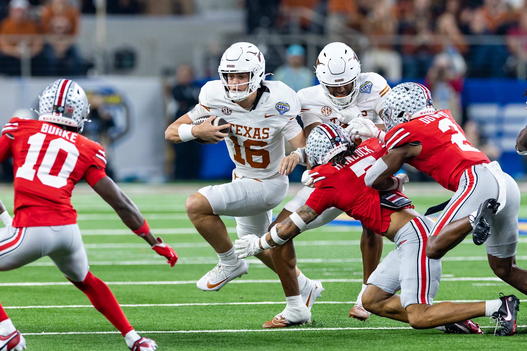 ARLINGTON, TX - JANUARY 10: Texas Longhorns quarterback Arch Manning (#16) runs up field for a first down during the CFP Semifinal Cotton Bowl Classic football game between the Ohio State Buckeyes and Texas Longhorns on January 10, 2025 at AT&T Stadium in Arlington, TX.  (Photo by Matthew Visinsky/Icon Sportswire via Getty Images)