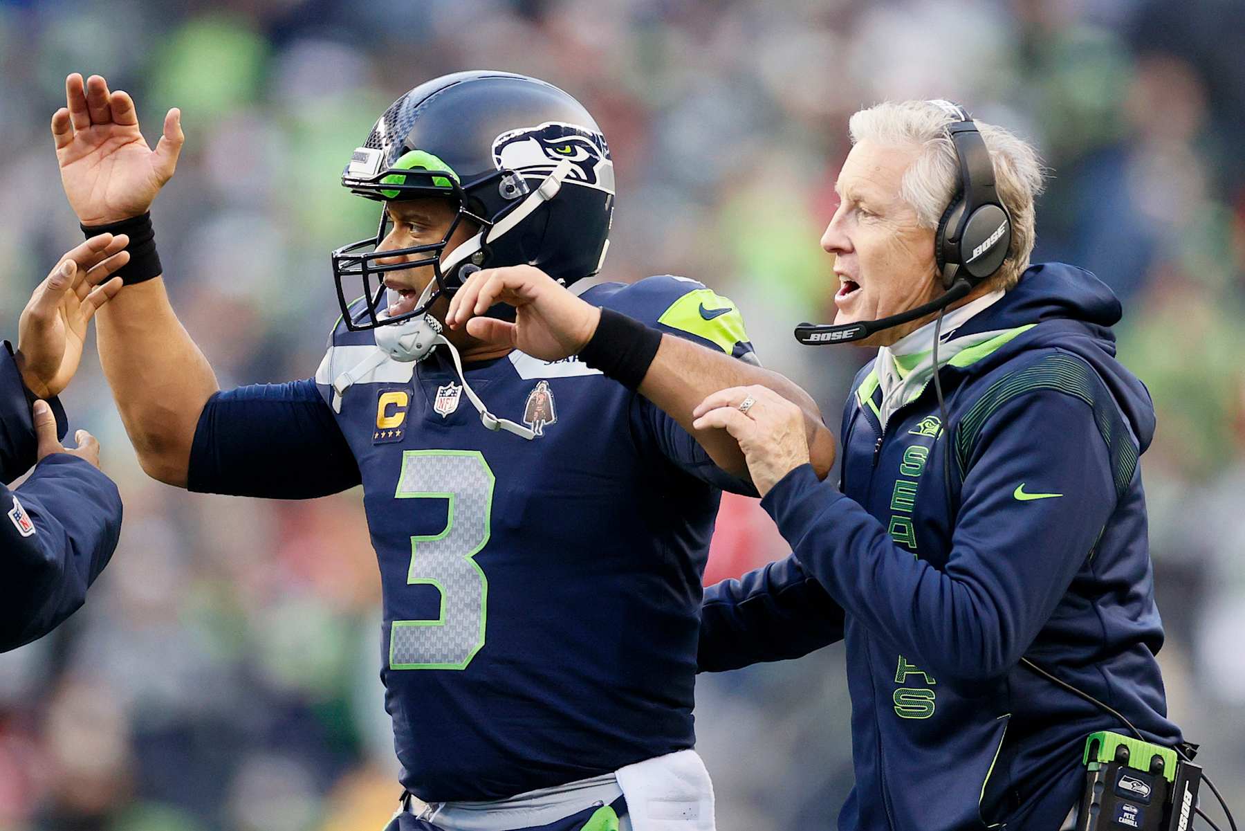 QB Russell Wilson (left) and HC Pete Carroll (right)