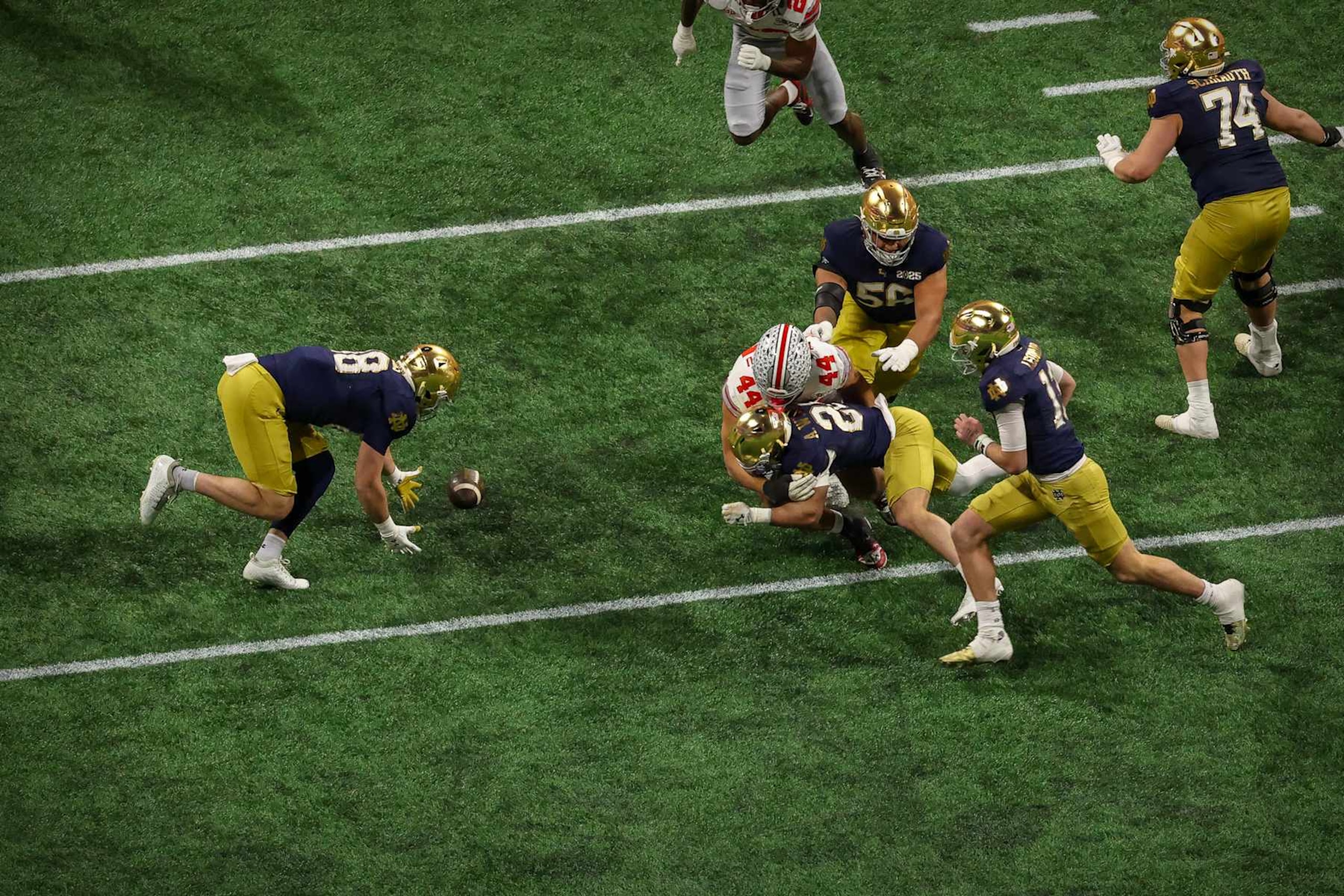 ATLANTA, GEORGIA - JANUARY 20: Armel Mukam #88 of the Notre Dame Fighting Irish recovers a fumble by JT Tuimoloau #44 of the Ohio State Buckeyes during the 2025 CFP National Championship Game at Mercedes-Benz Stadium on January 20, 2025 in Atlanta, Georgia. (Photo by CFP/Getty Images) ATLANTA, GEORGIA - JANUARY 20: Armel Mukam #88 of the Notre Dame Fighting Irish recovers a fumble by JT Tuimoloau #44 of the Ohio State Buckeyes during the 2025 CFP National Championship Game at Mercedes-Benz Stadium on January 20, 2025 in Atlanta, Georgia. (Photo by CFP/Getty Images)