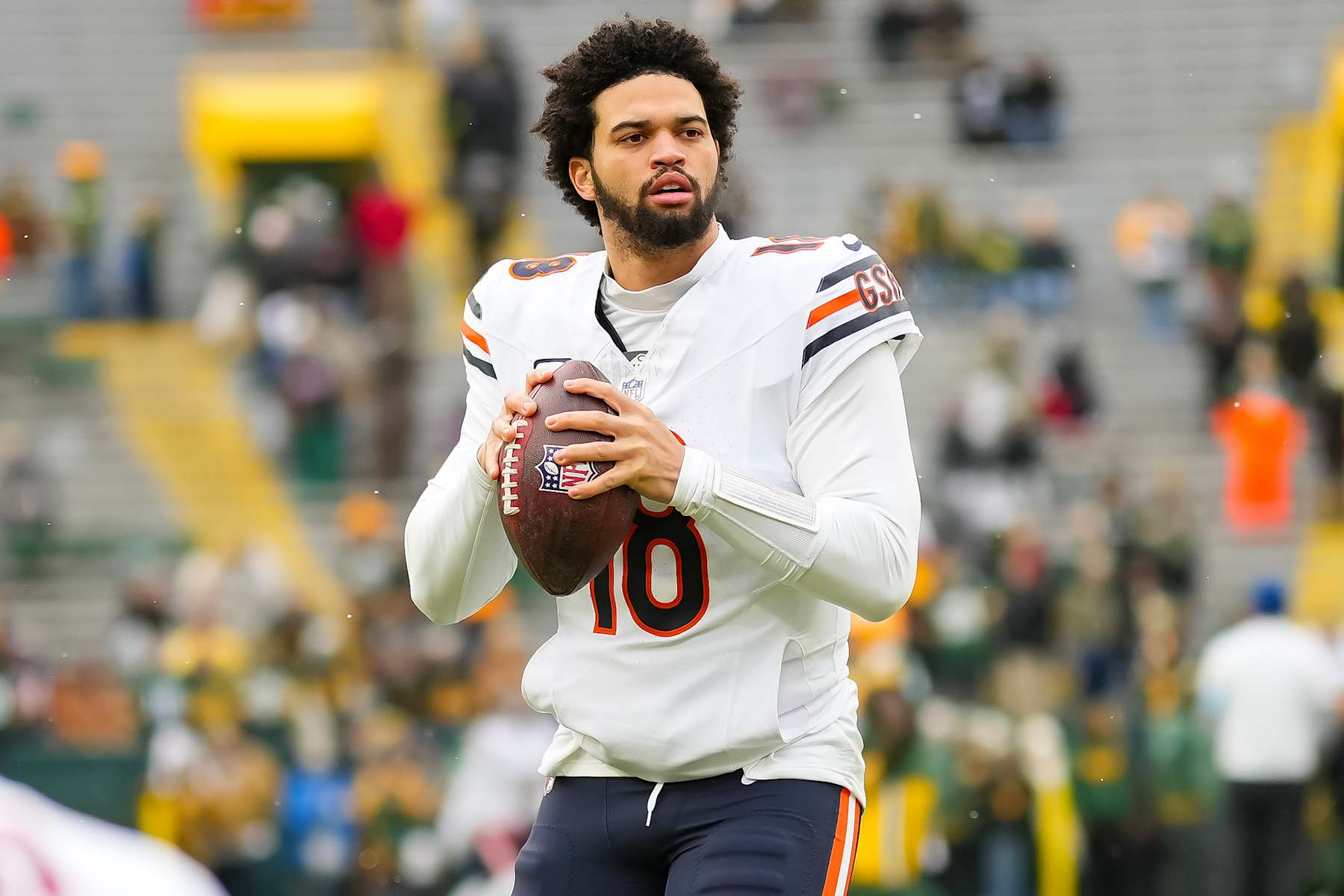 GREEN BAY, WISCONSIN - JANUARY 5: Quarterback Caleb Williams #18 of the Chicago Bears warms up prior to an NFL football game against the Green Bay Packers, at Lambeau Field on January 5, 2025 in Green Bay, Wisconsin. (Photo by Todd Rosenberg/Getty Images) GREEN BAY, WISCONSIN - JANUARY 5: Quarterback Caleb Williams #18 of the Chicago Bears warms up prior to an NFL football game against the Green Bay Packers, at Lambeau Field on January 5, 2025 in Green Bay, Wisconsin. (Photo by Todd Rosenberg/Getty Images)