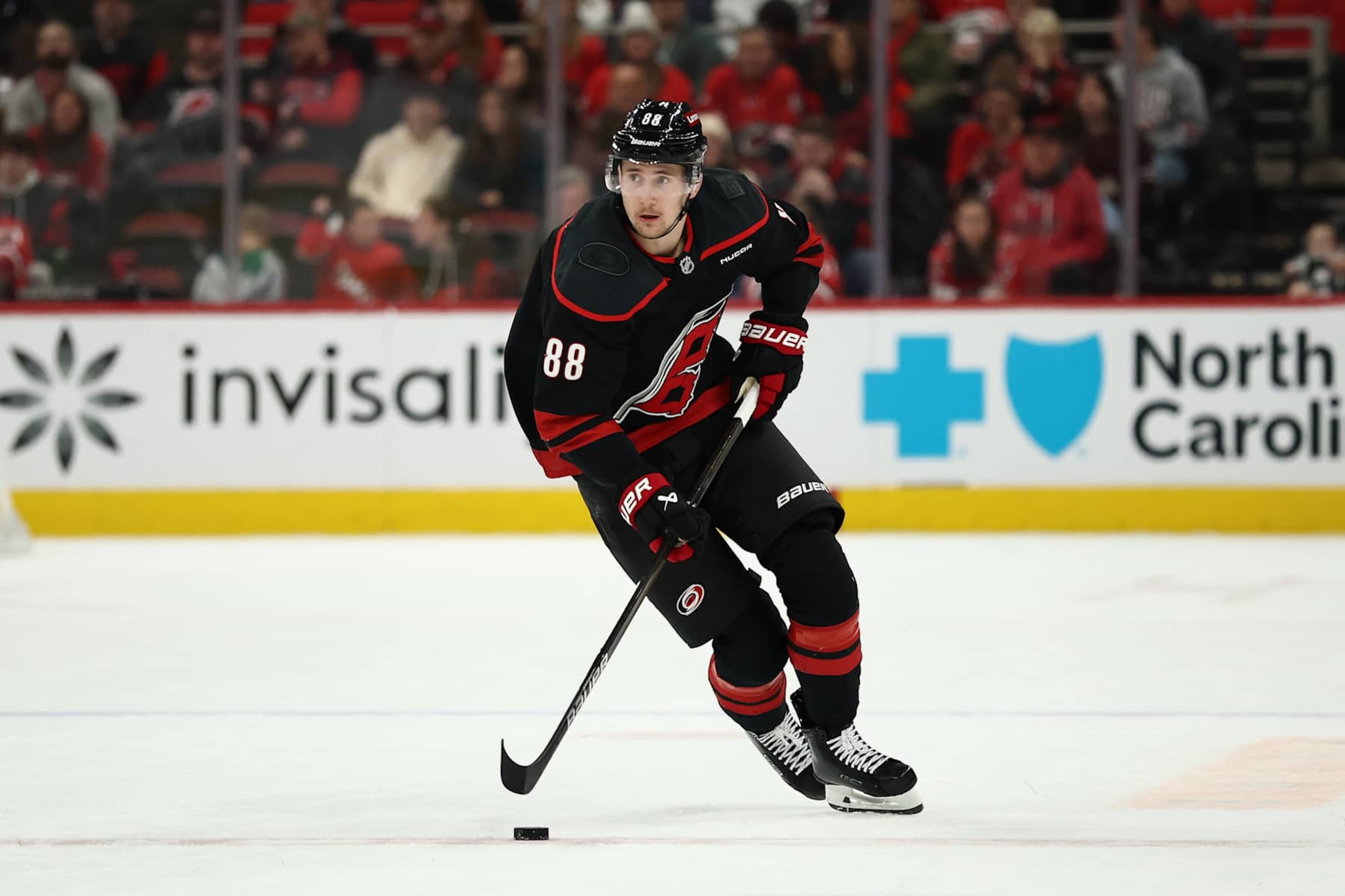 RALEIGH, NORTH CAROLINA - JANUARY 05: Martin Necas #88 of the Carolina Hurricanes skates with the puck during the overtime period of the game against the Pittsburgh Penguins at Lenovo Center on January 05, 2025 in Raleigh, North Carolina. (Photo by Jared C. Tilton/Getty Images)