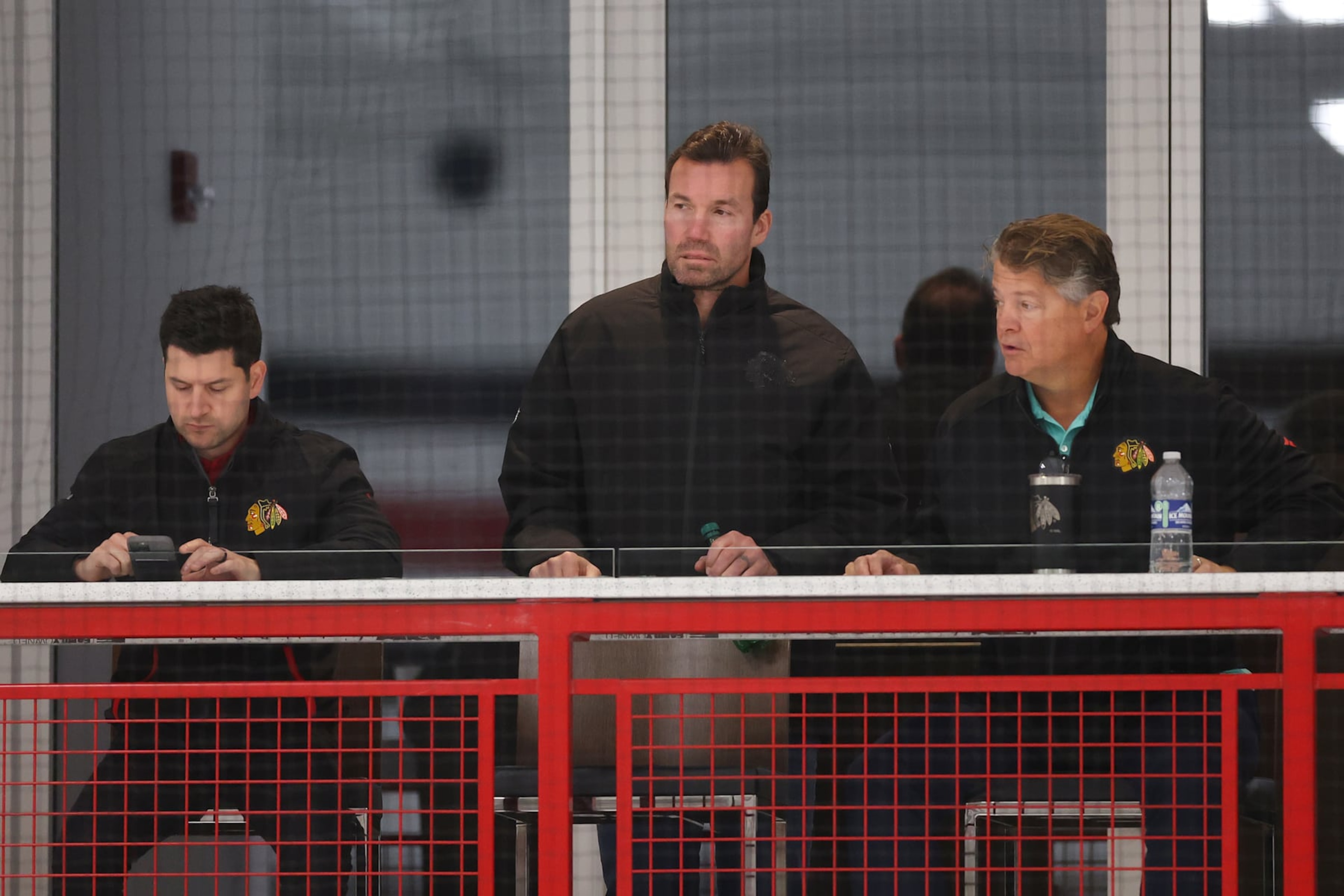 CHICAGO, ILLINOIS - SEPTEMBER 14: (L-R) General manager Kyle Davidson, head coach Luke Richardson and assistant coach Kevin Dean of the Chicago Blackhawks look on during Prospect Camp practice at Fifth Third Arena on September 14, 2023 in Chicago, Illinois. (Photo by Michael Reaves/Getty Images) CHICAGO, ILLINOIS - SEPTEMBER 14: (L-R) General manager Kyle Davidson, head coach Luke Richardson and assistant coach Kevin Dean of the Chicago Blackhawks look on during Prospect Camp practice at Fifth Third Arena on September 14, 2023 in Chicago, Illinois. (Photo by Michael Reaves/Getty Images)