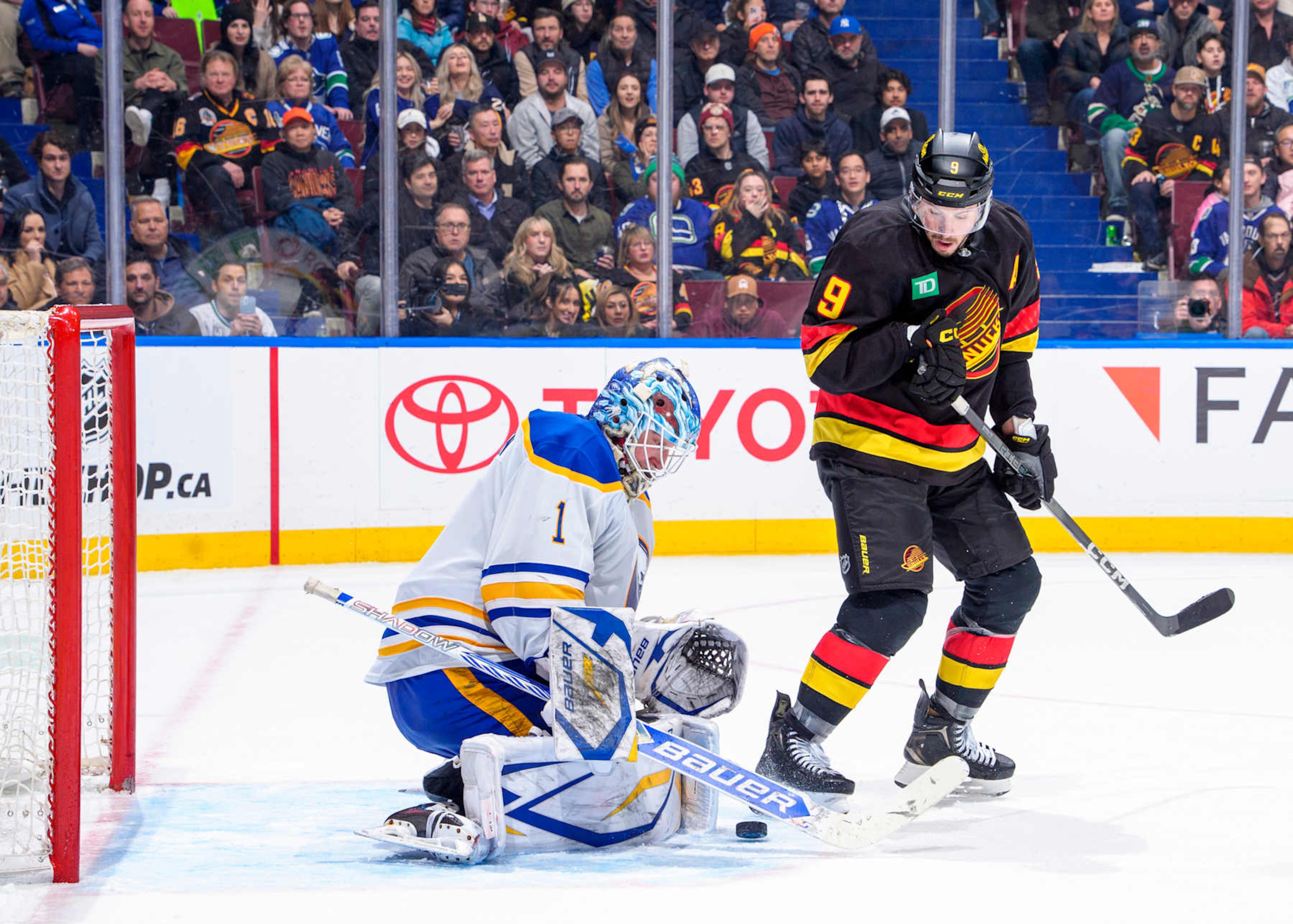 VANCOUVER, CANADA - JANUARY 21: Ukko-Pekka Luukkonen #1 of the Buffalo Sabres blocks a shot from J.T. Miller #9 of the Vancouver Canucks during the third period of their NHL game at Rogers Arena on January 21, 2025 in Vancouver, British Columbia, Canada. (Photo by Jeff Vinnick/NHLI via Getty Images) VANCOUVER, CANADA - JANUARY 21: Ukko-Pekka Luukkonen #1 of the Buffalo Sabres blocks a shot from J.T. Miller #9 of the Vancouver Canucks during the third period of their NHL game at Rogers Arena on January 21, 2025 in Vancouver, British Columbia, Canada. (Photo by Jeff Vinnick/NHLI via Getty Images)