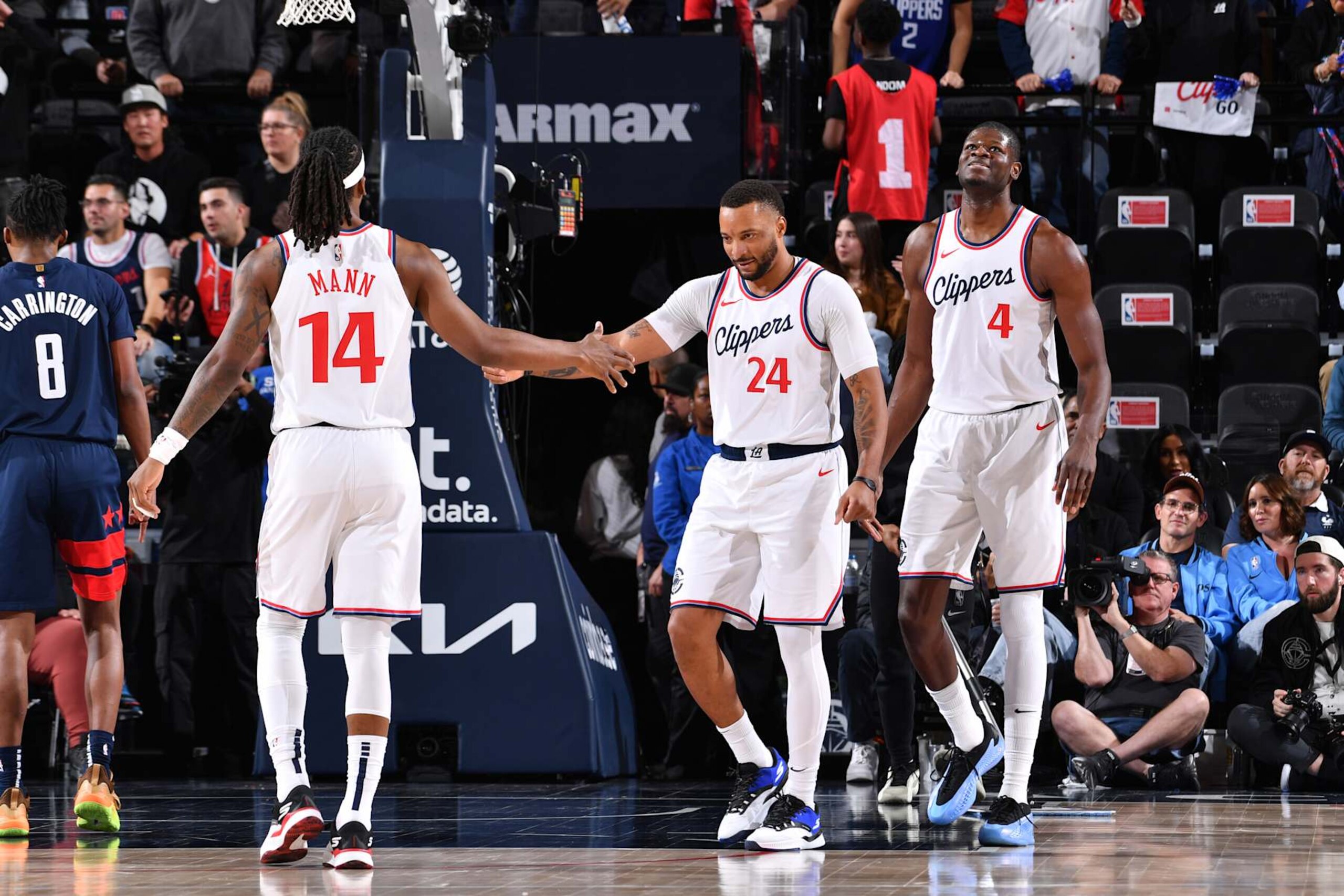 INGLEWOOD, CA - JANUARY 23:  Terance Mann #14 high fives Norman Powell #24 of the LA Clippers during the game against the Washington Wizards on January 23, 2025 at Intuit Dome in Los Angeles, California. NOTE TO USER: User expressly acknowledges and agrees that, by downloading and/or using this Photograph, user is consenting to the terms and conditions of the Getty Images License Agreement. Mandatory Copyright Notice: Copyright 2025 NBAE (Photo by Juan Ocampo/NBAE via Getty Images)