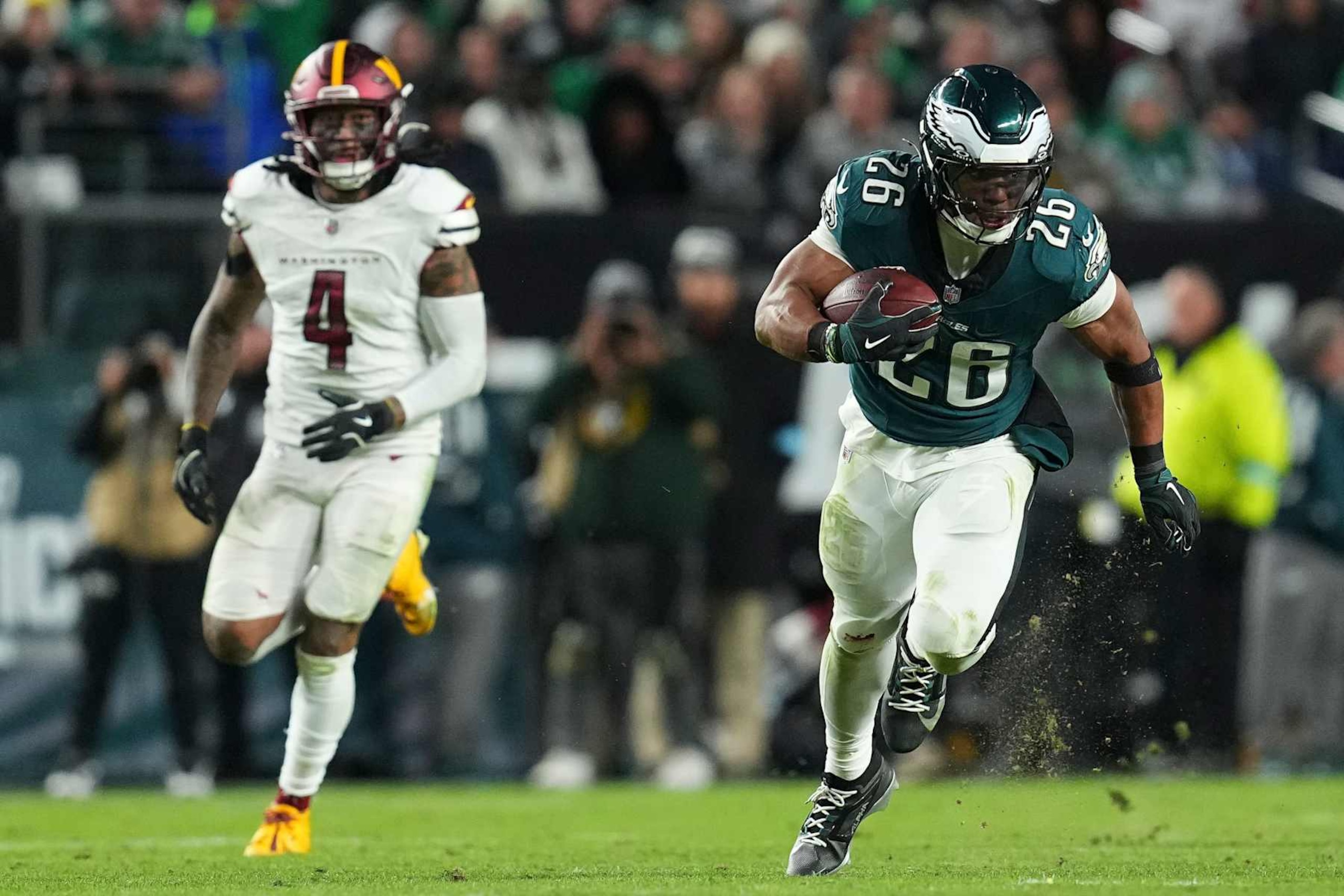 PHILADELPHIA, PENNSYLVANIA - NOVEMBER 14: Saquon Barkley #26 of the Philadelphia Eagles runs the ball against Frankie Luvu #4 of the Washington Commanders at Lincoln Financial Field on November 14, 2024 in Philadelphia, Pennsylvania. (Photo by Mitchell Leff/Getty Images) PHILADELPHIA, PENNSYLVANIA - NOVEMBER 14: Saquon Barkley #26 of the Philadelphia Eagles runs the ball against Frankie Luvu #4 of the Washington Commanders at Lincoln Financial Field on November 14, 2024 in Philadelphia, Pennsylvania. (Photo by Mitchell Leff/Getty Images)