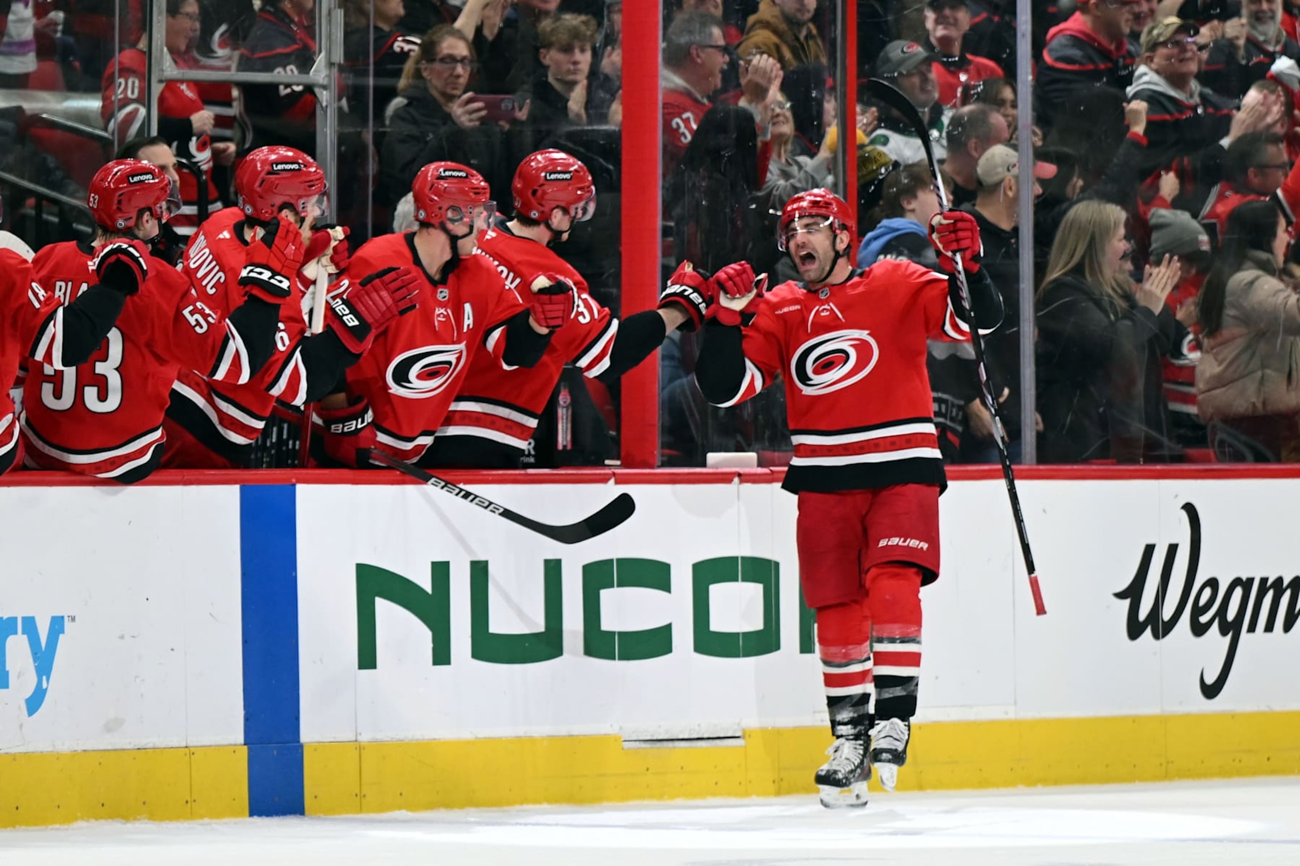 RALEIGH, NC - JANUARY 23: Carolina Hurricanes left wing Jordan Martinook (48) fist bumps teammates after scoring during the NHL game between the Columbus Blue Jackets and the Carolina Hurricanes on January 23, 2025 at Lenovo Center in Raleigh, North Carolina. (Photo by Katherine Gawlik/Icon Sportswire via Getty Images)