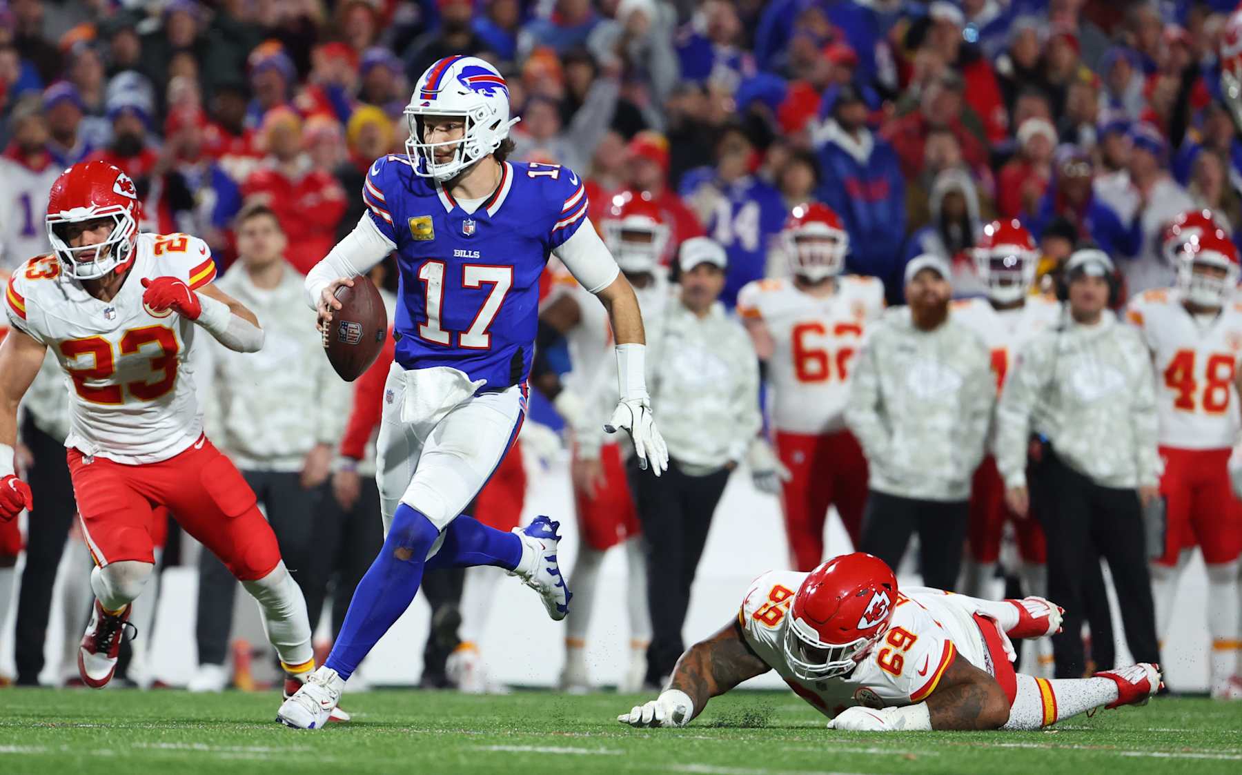 ORCHARD PARK, NEW YORK - NOVEMBER 17: Mike Pennel Jr. #69 of the Kansas City Chiefs tries to make a tackle on Josh Allen #17 of the Buffalo Bills as he runs the ball during a game at Highmark Stadium on November 17, 2024 in Orchard Park, New York. (Photo by Timothy T Ludwig/Getty Images)