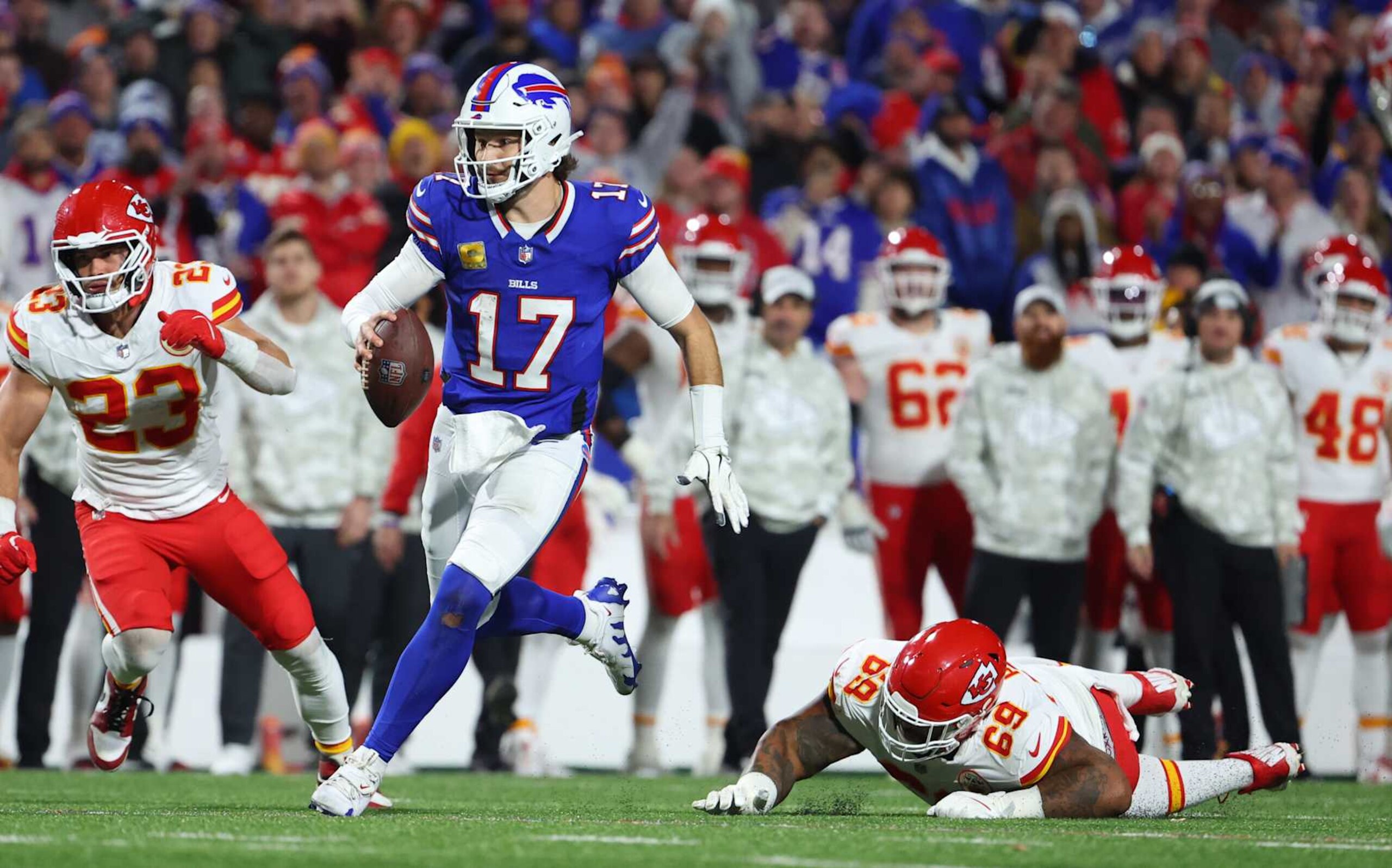 ORCHARD PARK, NEW YORK - NOVEMBER 17: Mike Pennel Jr. #69 of the Kansas City Chiefs tries to make a tackle on Josh Allen #17 of the Buffalo Bills as he runs the ball during a game at Highmark Stadium on November 17, 2024 in Orchard Park, New York. (Photo by Timothy T Ludwig/Getty Images)