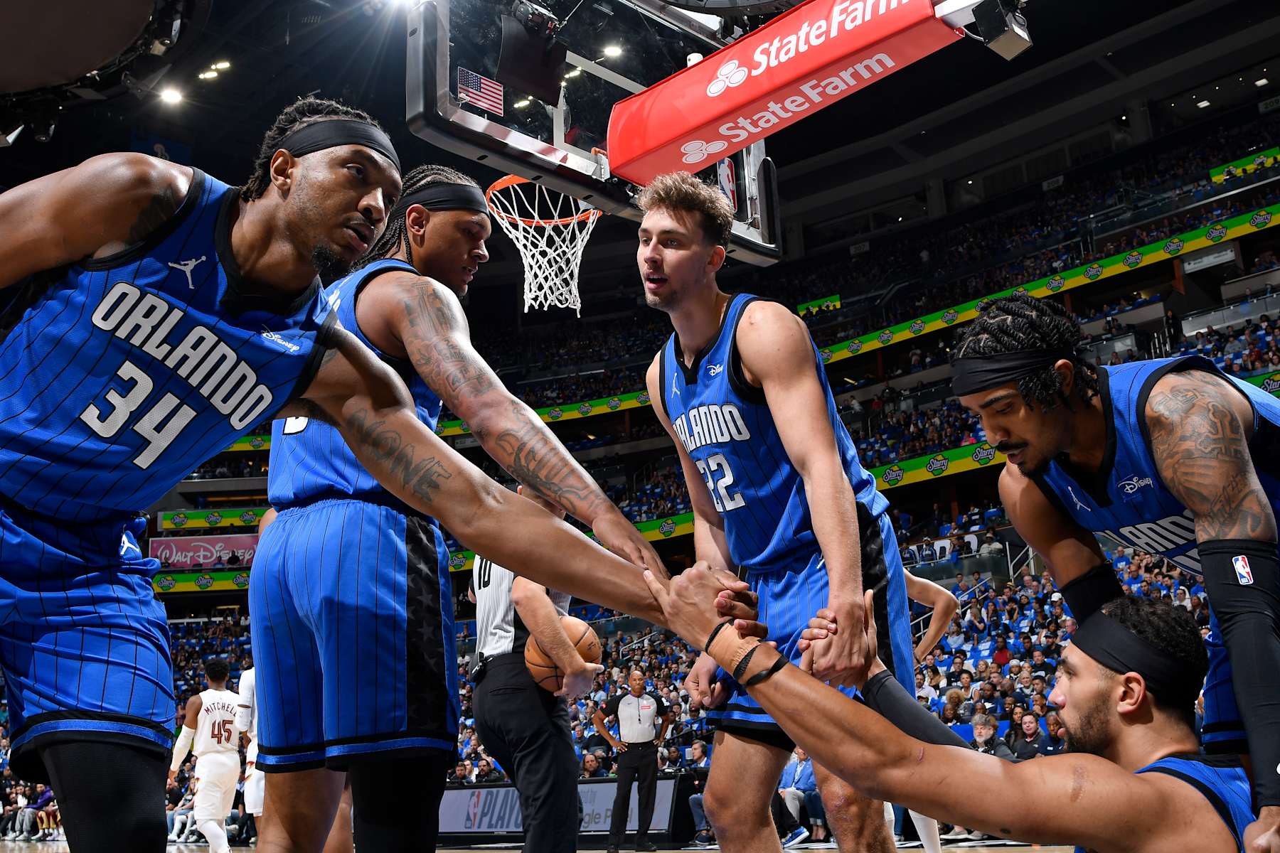 ORLANDO, FL - APRIL 27: Wendell Carter Jr. #34, Paolo Banchero #5, Franz Wagner #22 and Gary Harris #14 of the Orlando Magic help up Jalen Suggs #4 during the game against the Cleveland Cavaliers during Round 1 Game 4 of the 2024 NBA Playoffs on April 27, 2024 at the Kia Center in Orlando, Florida. NOTE TO USER: User expressly acknowledges and agrees that, by downloading and or using this photograph, User is consenting to the terms and conditions of the Getty Images License Agreement. Mandatory Copyright Notice: Copyright 2024 NBAE (Photo by Fernando Medina/NBAE via Getty Images)