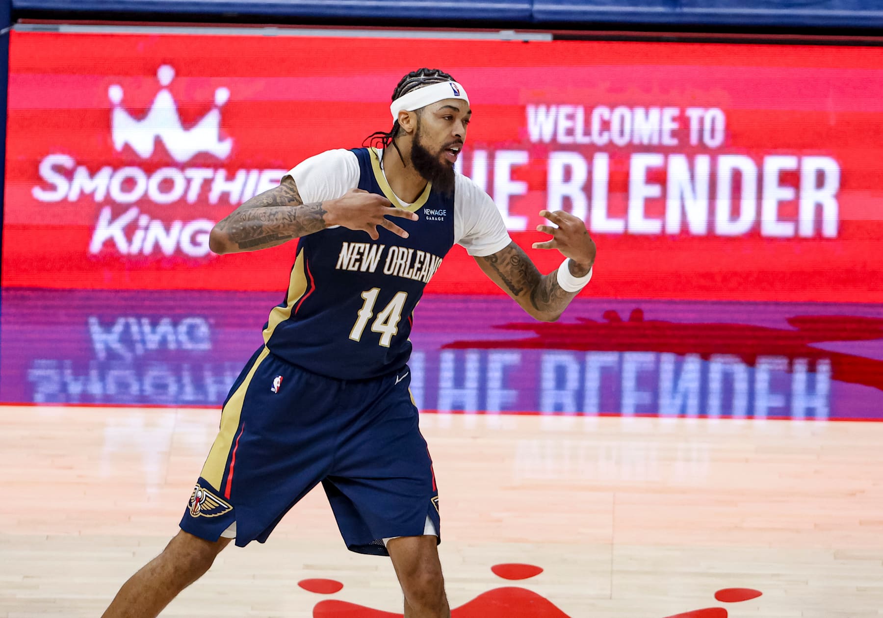 NEW ORLEANS, LOUISIANA - DECEMBER 5:  Brandon Ingram #14 of the New Orleans Pelicans reacts after scoring on a three point basket against the Phoenix Suns during the second half of a game at the Smoothie King Center on December 5, 2024 in New Orleans, Louisiana. NOTE TO USER: User expressly acknowledges and agrees that, by downloading and or using this photograph, User is consenting to the terms and conditions of the Getty Images License Agreement. (Photo by Derick E. Hingle/Getty Images)