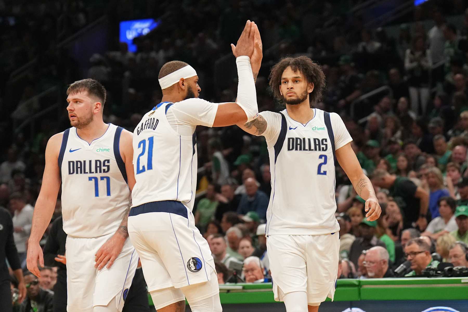 BOSTON, MA - JUNE 9:  Daniel Gafford #21 of the Dallas Mavericks and Dereck Lively II #2 of the Dallas Mavericks high five during the game  against the Boston Celtics during Game 2 of the 2024 NBA Finals on June 9, 2024 at the TD Garden in Boston, Massachusetts. NOTE TO USER: User expressly acknowledges and agrees that, by downloading and or using this photograph, User is consenting to the terms and conditions of the Getty Images License Agreement. Mandatory Copyright Notice: Copyright 2024 NBAE  (Photo by Jesse D. Garrabrant/NBAE via Getty Images)