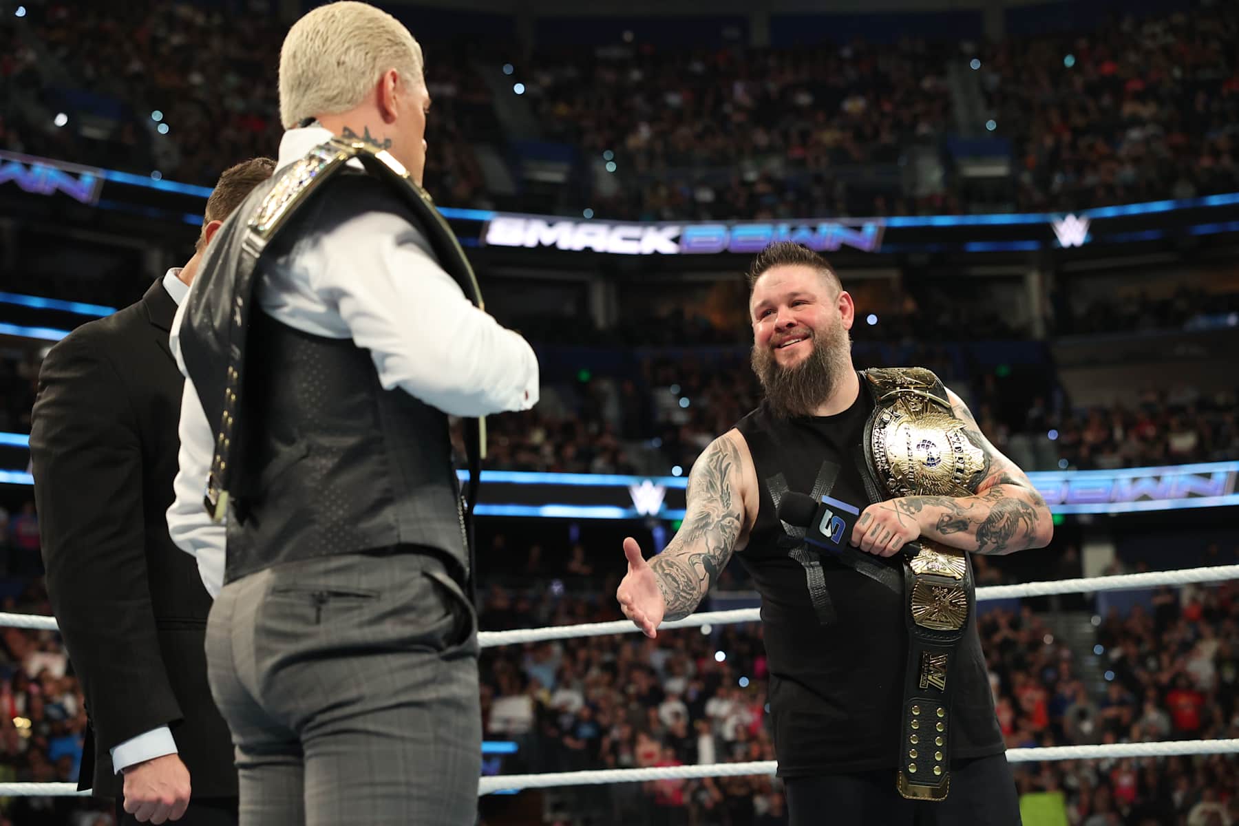 TAMPA, FLORIDA - DECEMBER 27: Kevin Owens offers Cody Rhodes a hand shake during SmackDown at Amalie Arena on December 27, 2024 in Tampa, Florida.  (Photo by WWE/Getty Images)