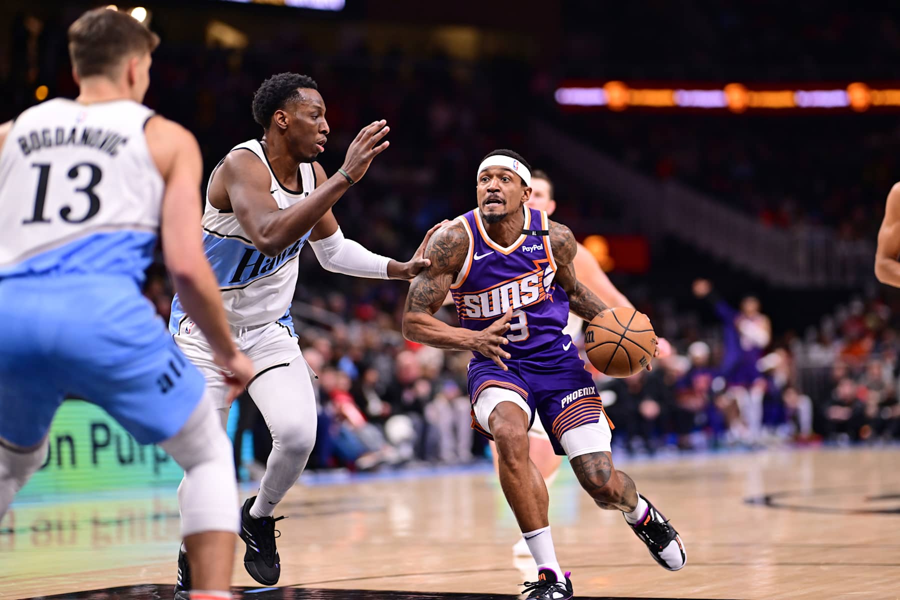 ATLANTA, GA - JANUARY 14: Bradley Beal #3 of the Phoenix Suns dribbles the ball during the game against the Atlanta Hawks on January 14, 2025 at State Farm Arena in Atlanta, Georgia.  NOTE TO USER: User expressly acknowledges and agrees that, by downloading and/or using this Photograph, user is consenting to the terms and conditions of the Getty Images License Agreement. Mandatory Copyright Notice: Copyright 2024 NBAE (Photo by Adam Hagy/NBAE via Getty Images)