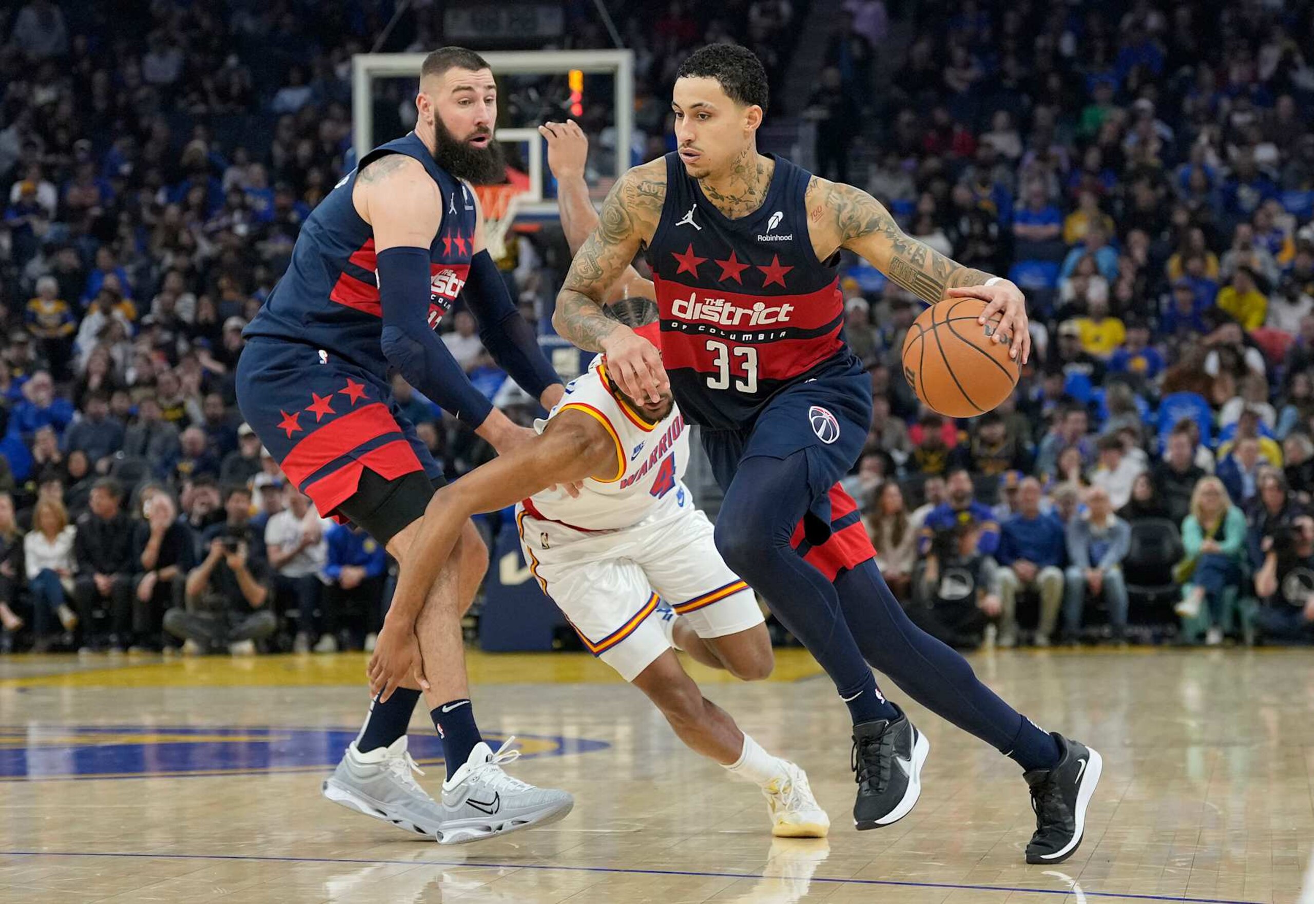 SAN FRANCISCO, CALIFORNIA - JANUARY 18: Kyle Kuzma #33 of the Washington Wizards dribbles around a screen set by Jonas Valanciunas #17 on Moses Moody #4 of the Golden State Warriors during the first half of an NBA basketball game at Chase Center on January 18, 2025 in San Francisco, California. NOTE TO USER: User expressly acknowledges and agrees that, by downloading and or using this photograph, User is consenting to the terms and conditions of the Getty Images License Agreement. (Photo by Thearon W. Henderson/Getty Images) SAN FRANCISCO, CALIFORNIA - JANUARY 18: Kyle Kuzma #33 of the Washington Wizards dribbles around a screen set by Jonas Valanciunas #17 on Moses Moody #4 of the Golden State Warriors during the first half of an NBA basketball game at Chase Center on January 18, 2025 in San Francisco, California. NOTE TO USER: User expressly acknowledges and agrees that, by downloading and or using this photograph, User is consenting to the terms and conditions of the Getty Images License Agreement. (Photo by Thearon W. Henderson/Getty Images)