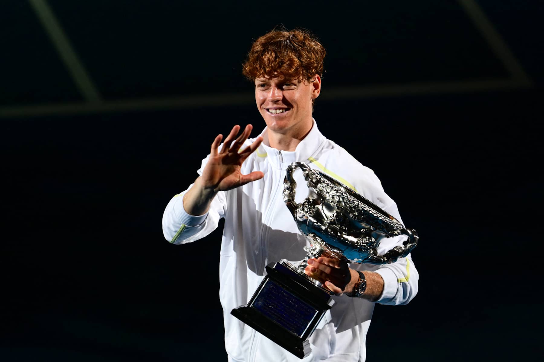 Italy's Jannik Sinner celebrates with the Norman Brookes Challenge Cup trophy after defeating Germany's Alexander Zverev during their men's singles final match on day fifteen of the Australian Open tennis tournament in Melbourne on January 26, 2025. (Photo by Yuichi YAMAZAKI / AFP) / -- IMAGE RESTRICTED TO EDITORIAL USE - STRICTLY NO COMMERCIAL USE -- (Photo by YUICHI YAMAZAKI/AFP via Getty Images)