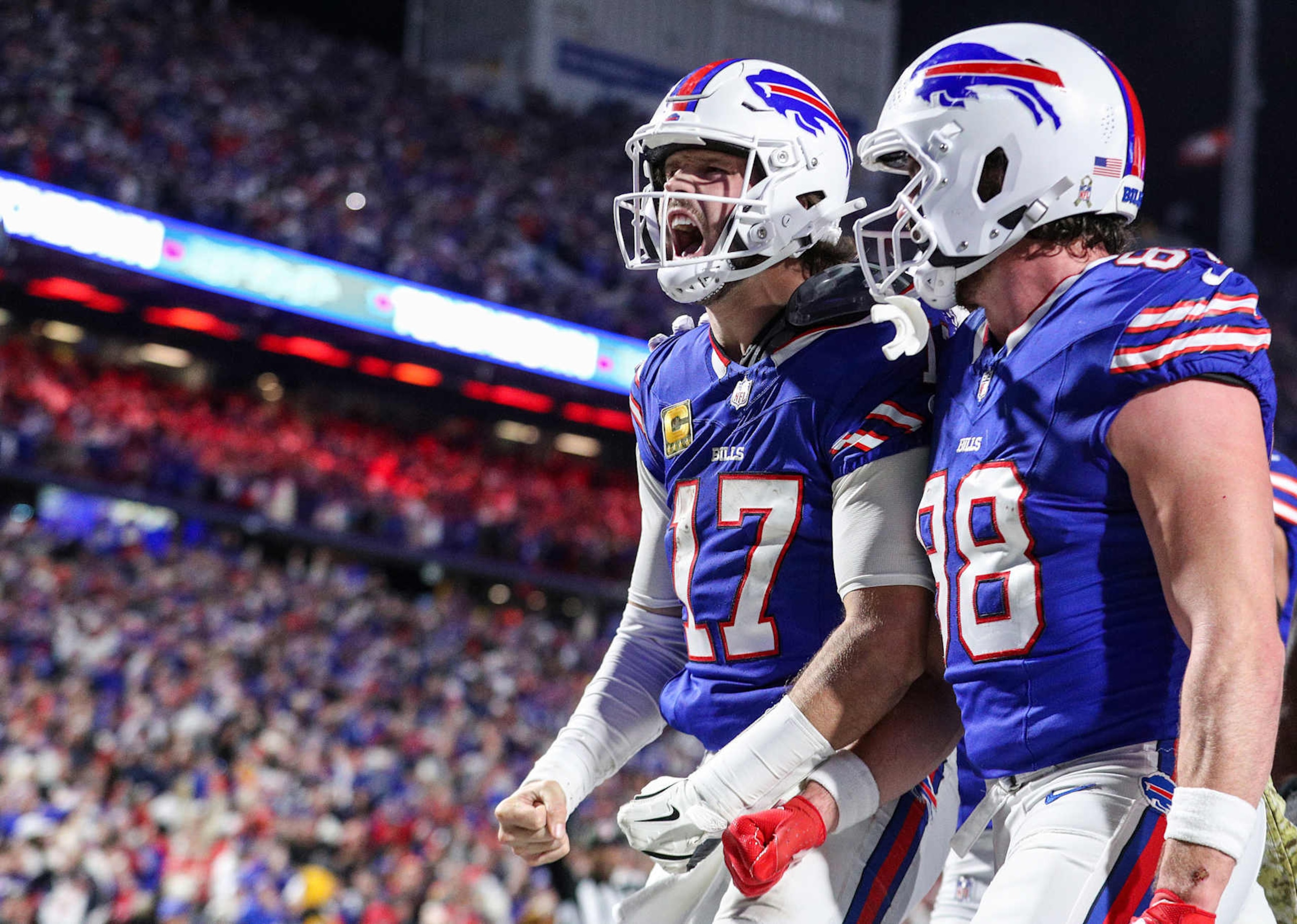 ORCHARD PARK, NEW YORK - NOVEMBER 17: Josh Allen #17 of the Buffalo Bills celebrates his rushing touchdown with teammate Dawson Knox #88 against the Kansas City Chiefs during the fourth quarter at Highmark Stadium on November 17, 2024 in Orchard Park, New York. (Photo by Bryan M. Bennett/Getty Images)