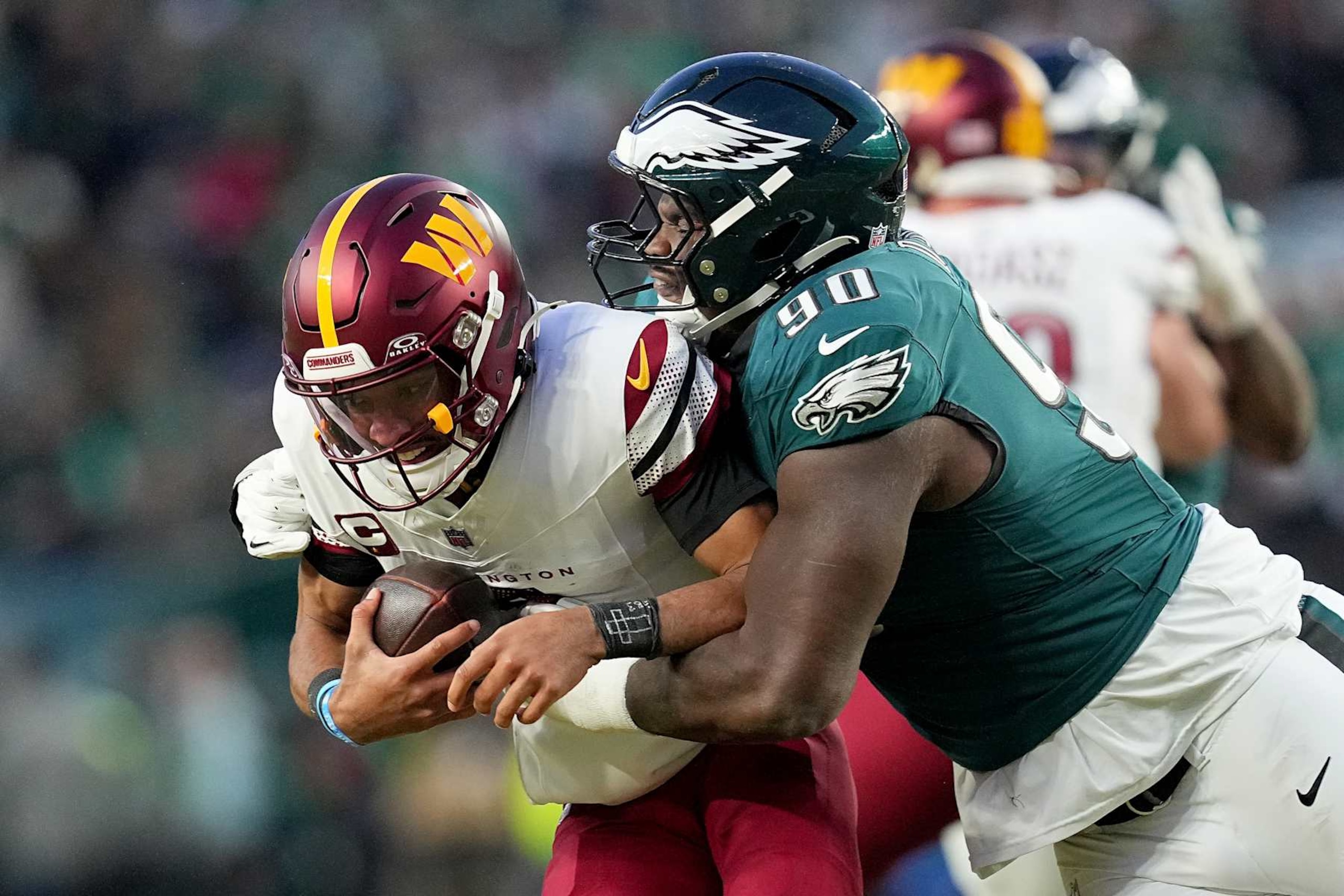PHILADELPHIA, PENNSYLVANIA - JANUARY 26: Jordan Davis #90 of the Philadelphia Eagles sacks Jayden Daniels #5 of the Washington Commanders during the third quarter in the NFC Championship Game at Lincoln Financial Field on January 26, 2025 in Philadelphia, Pennsylvania. (Photo by Mitchell Leff/Getty Images) PHILADELPHIA, PENNSYLVANIA - JANUARY 26: Jordan Davis #90 of the Philadelphia Eagles sacks Jayden Daniels #5 of the Washington Commanders during the third quarter in the NFC Championship Game at Lincoln Financial Field on January 26, 2025 in Philadelphia, Pennsylvania. (Photo by Mitchell Leff/Getty Images)