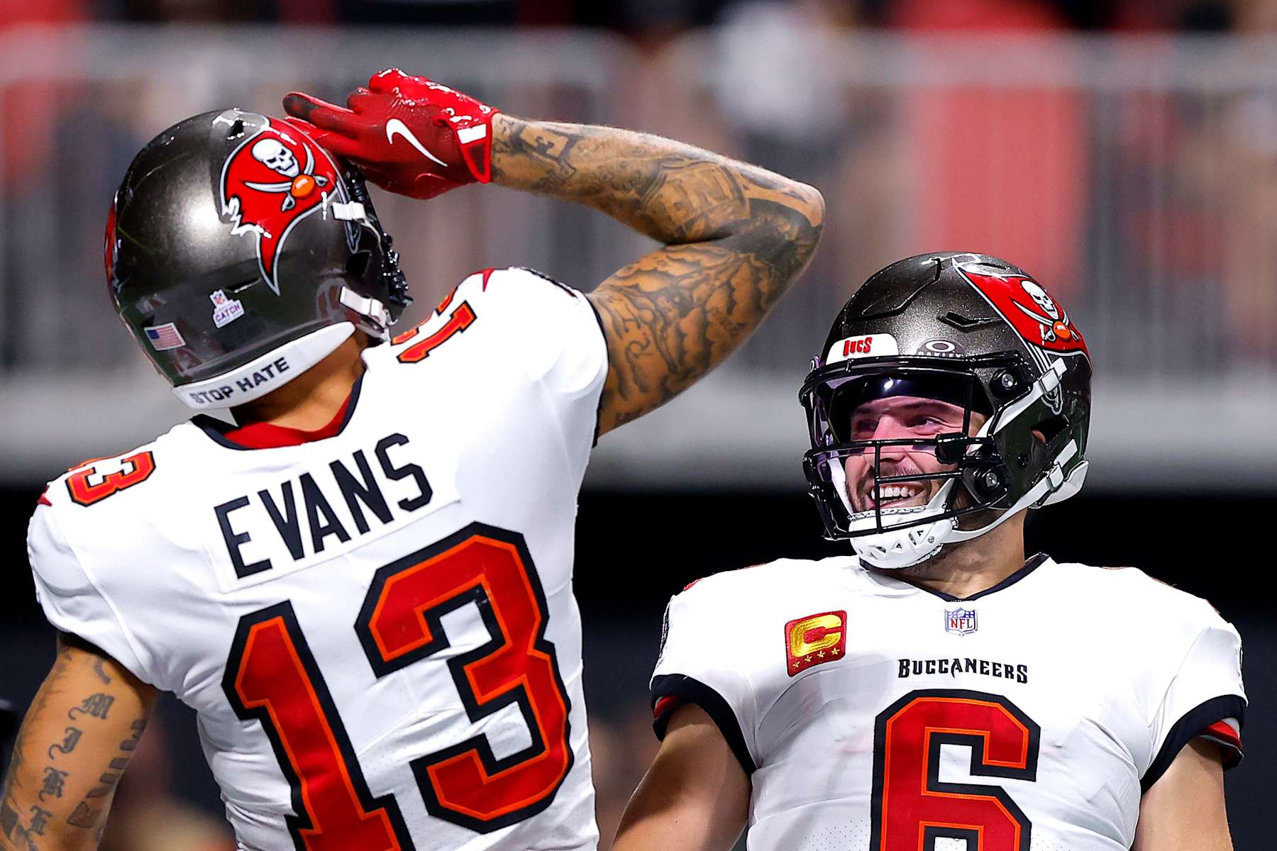 Buccaneers WR Mike Evans (left) and QB Baker Mayfield (right)