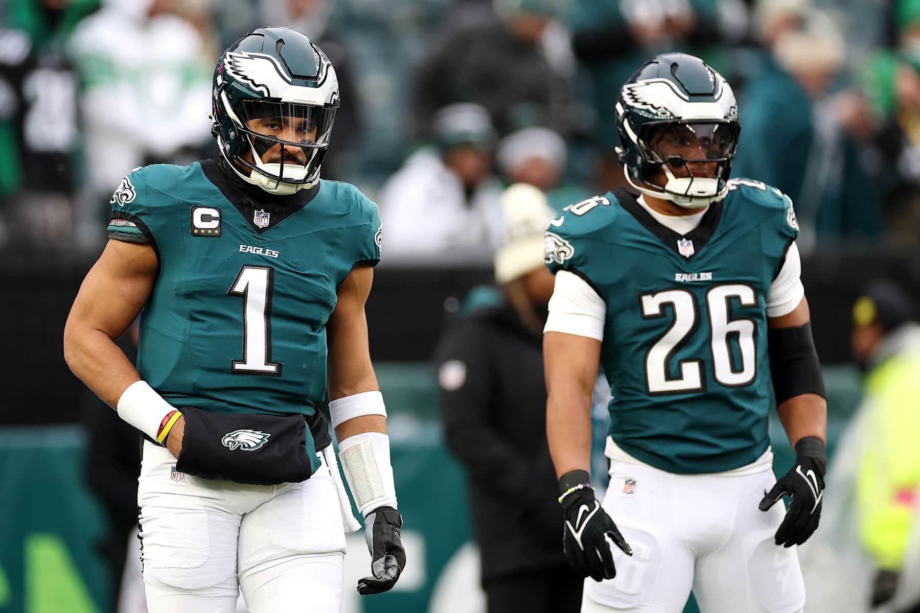 Eagles QB Jalen Hurts (left) and RB Saquon Barkley (right)