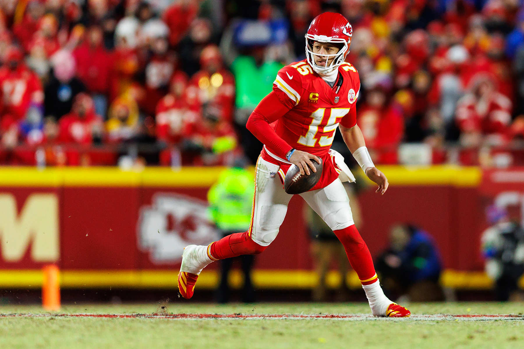 KANSAS CITY, MISSOURI - JANUARY 26: Quarterback Patrick Mahomes #15 of the Kansas City Chiefs scrambles out of the pocket during the second half of the AFC Championship football game against the Buffalo Bills, at GEHA Field at Arrowhead Stadium on January 26, 2025 in Kansas City, Missouri. (Photo by Brooke Sutton/Getty Images)