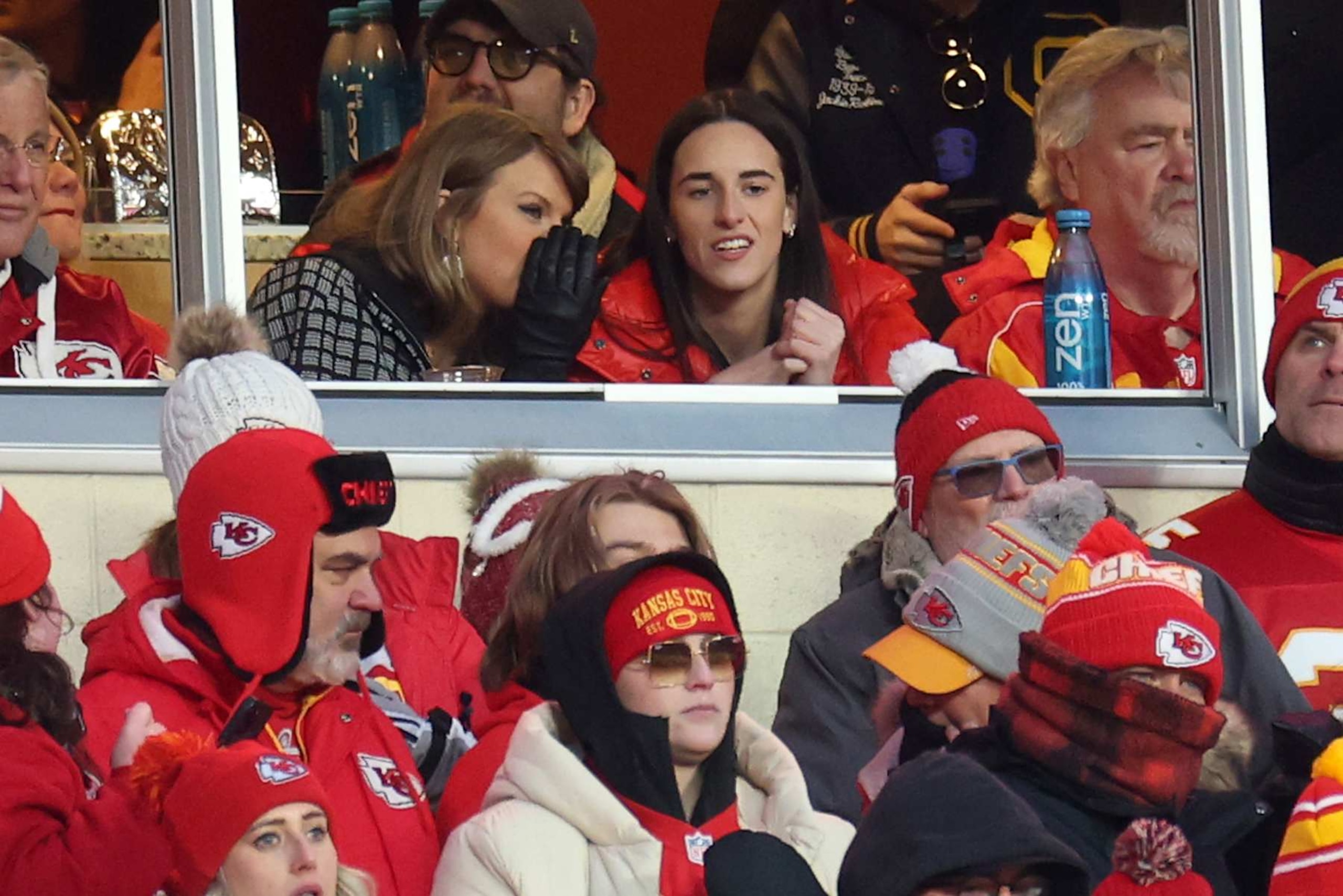 KANSAS CITY, MISSOURI - JANUARY 18: Singer-songwriter Taylor Swift (L) talks with Caitlin Clark (R) of the Indiana Fever during the second half in the AFC Divisional Playoff between the Houston Texans and the Kansas City Chiefs at GEHA Field at Arrowhead Stadium on January 18, 2025 in Kansas City, Missouri. (Photo by Jamie Squire/Getty Images) KANSAS CITY, MISSOURI - JANUARY 18: Singer-songwriter Taylor Swift (L) talks with Caitlin Clark (R) of the Indiana Fever during the second half in the AFC Divisional Playoff between the Houston Texans and the Kansas City Chiefs at GEHA Field at Arrowhead Stadium on January 18, 2025 in Kansas City, Missouri. (Photo by Jamie Squire/Getty Images)
