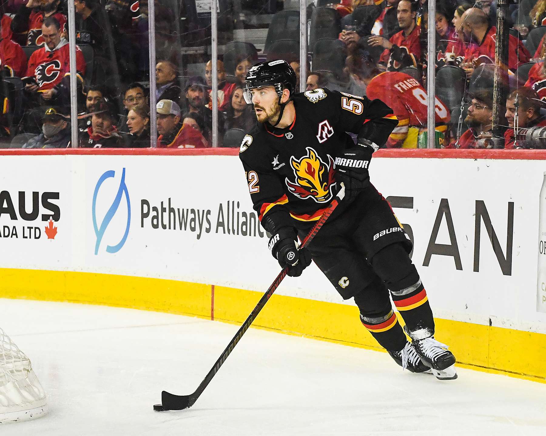 CALGARY, CANADA - JANUARY 11: MacKenzie Weegar #52 of the Calgary Flames in action against the Los Angeles Kings during an NHL game at Scotiabank Saddledome on January 11, 2025 in Calgary, Alberta, Canada.  (Photo by Derek Leung/Getty Images)