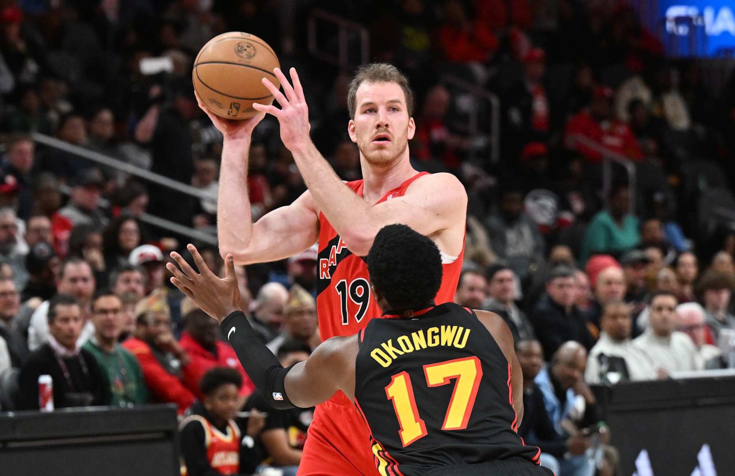 ATLANTA, GEORGIA - JANUARY 23: Jakob Poeltl #19 of the Toronto Raptors handles the ball during the game against the Atlanta Hawks on January 23, 2025 at State Farm Arena in Atlanta, Georgia.  NOTE TO USER: User expressly acknowledges and agrees that, by downloading and or using this photograph, User is consenting to the terms and conditions of the Getty Images License Agreement. (Photo by Paras Griffin/Getty Images)