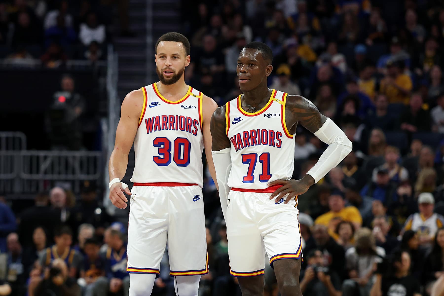 SAN FRANCISCO, CALIFORNIA - JANUARY 02: Stephen Curry #30 stands on the court with Dennis Schroder #71 of the Golden State Warriors during their game against the Philadelphia 76ers during the second half at Chase Center on January 02, 2025 in San Francisco, California. NOTE TO USER: User expressly acknowledges and agrees that, by downloading and/or using this photograph, user is consenting to the terms and conditions of the Getty Images License Agreement.   (Photo by Ezra Shaw/Getty Images)