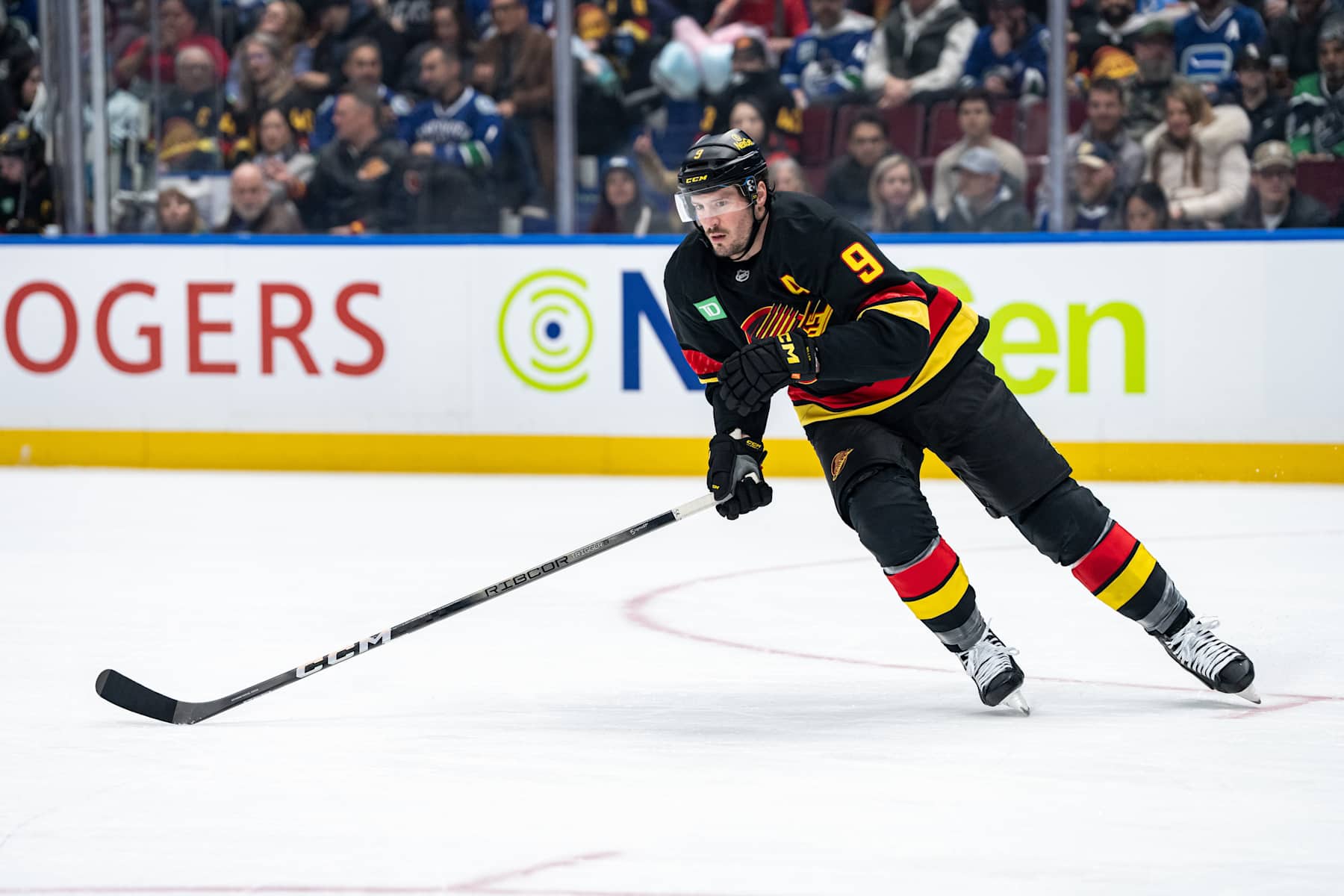 VANCOUVER, BC - JANUARY 21: Vancouver Canucks center J.T. Miller (9) skates up the ice during an NHL game between the Buffalo Sabres and the Vancouver Canucks on Tuesday, January 21, 2025 at Rogers Arena in Vancouver, B.C. (Photo by Ethan Cairns/Icon Sportswire via Getty Images)
