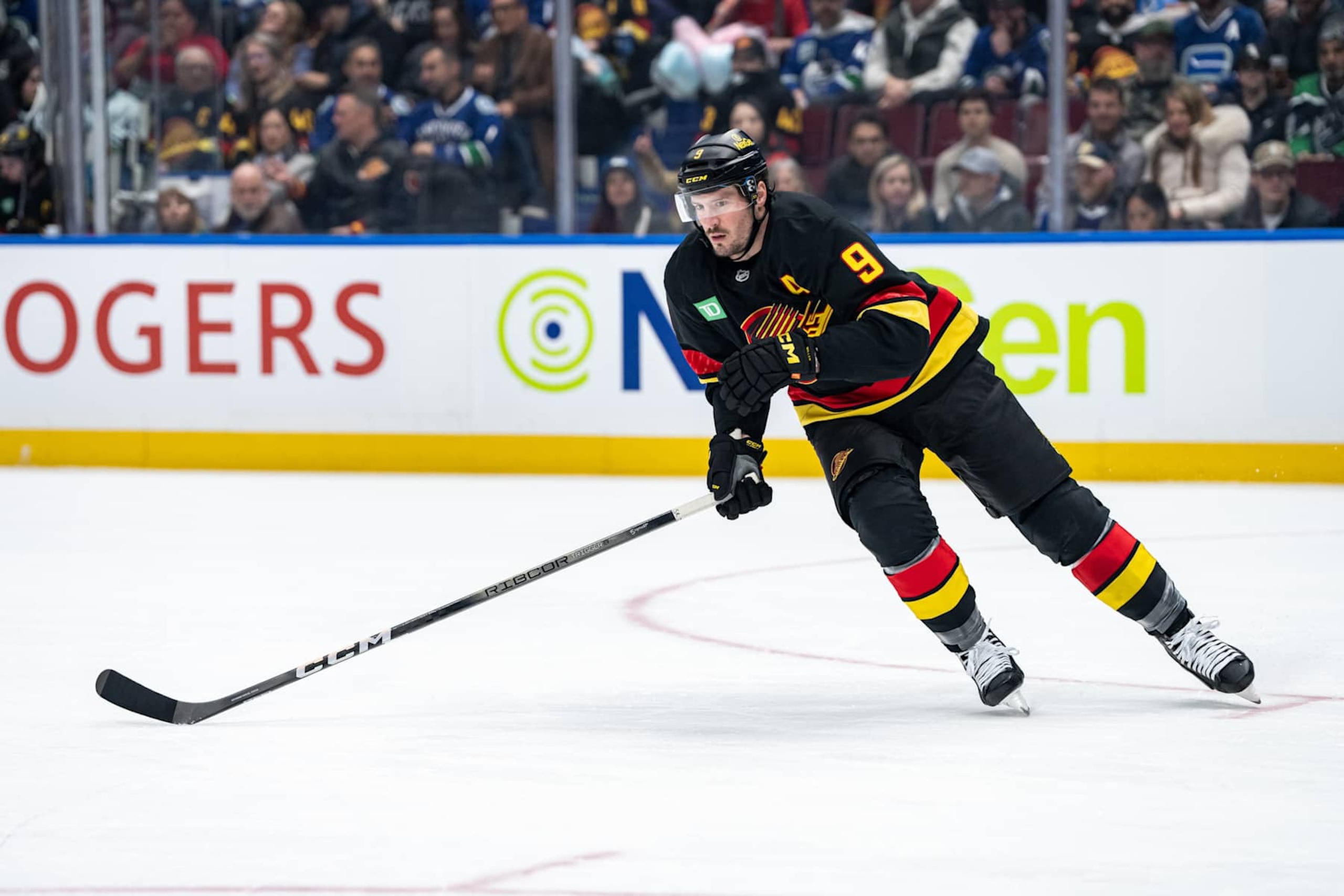 VANCOUVER, BC - JANUARY 21: Vancouver Canucks center J.T. Miller (9) skates up the ice during an NHL game between the Buffalo Sabres and the Vancouver Canucks on Tuesday, January 21, 2025 at Rogers Arena in Vancouver, B.C. (Photo by Ethan Cairns/Icon Sportswire via Getty Images)