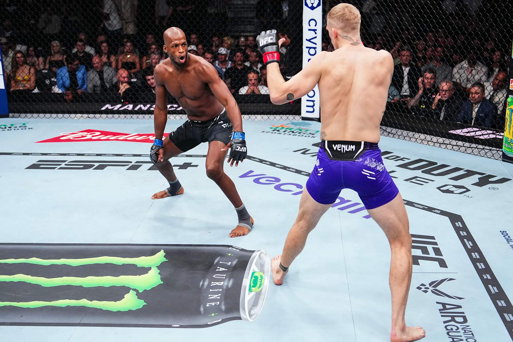 Michael Page faces off with Ian Machado Garry.