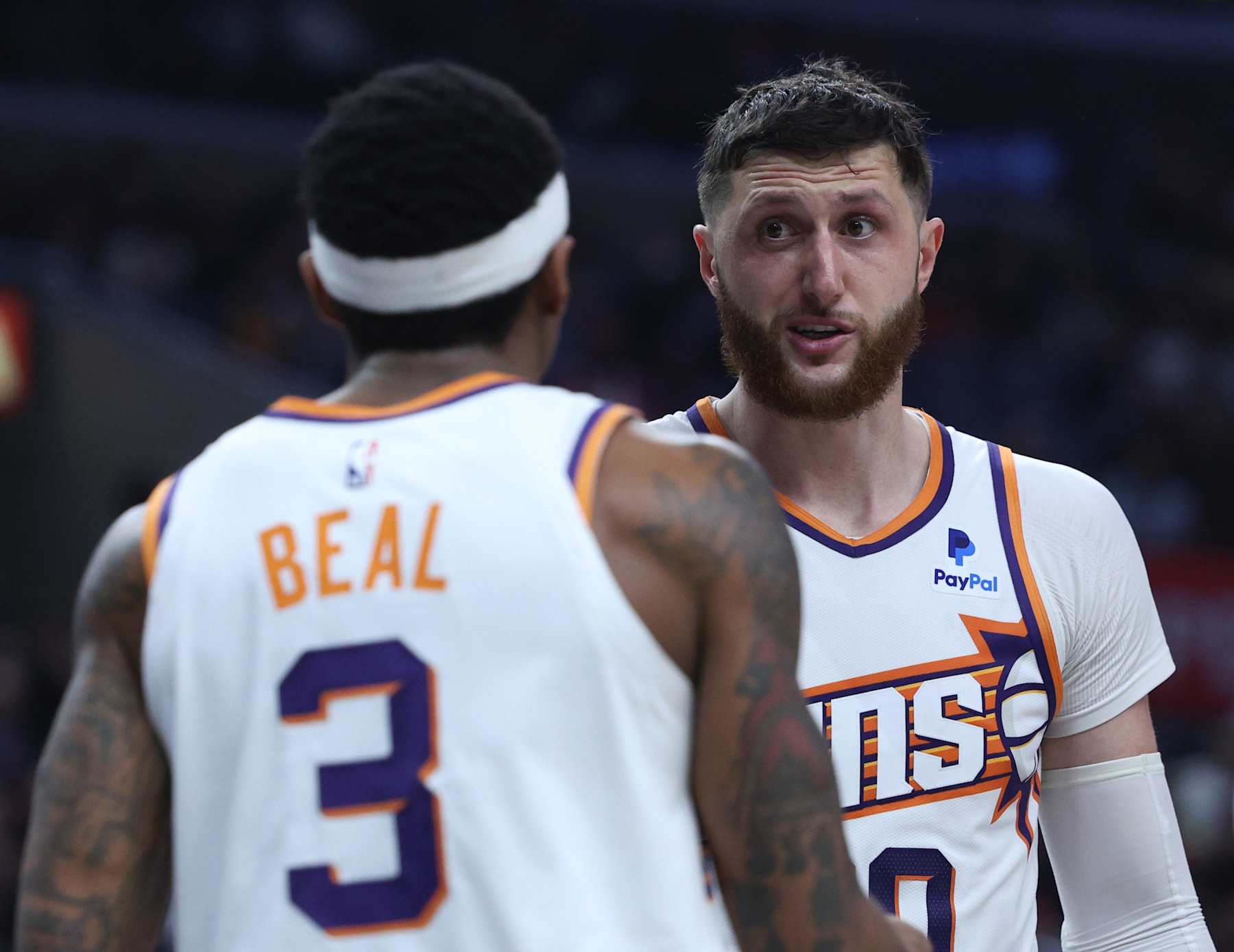 LOS ANGELES, CALIFORNIA - APRIL 10: Jusuf Nurkic #20 of the Phoenix Suns talks with Bradley Beal #3 during a 124-108 win over the LA Clippers at Crypto.com Arena on April 10, 2024 in Los Angeles, California. User is consenting to the terms and conditions of the Getty Images License Agreement.  (Photo by Harry How/Getty Images)