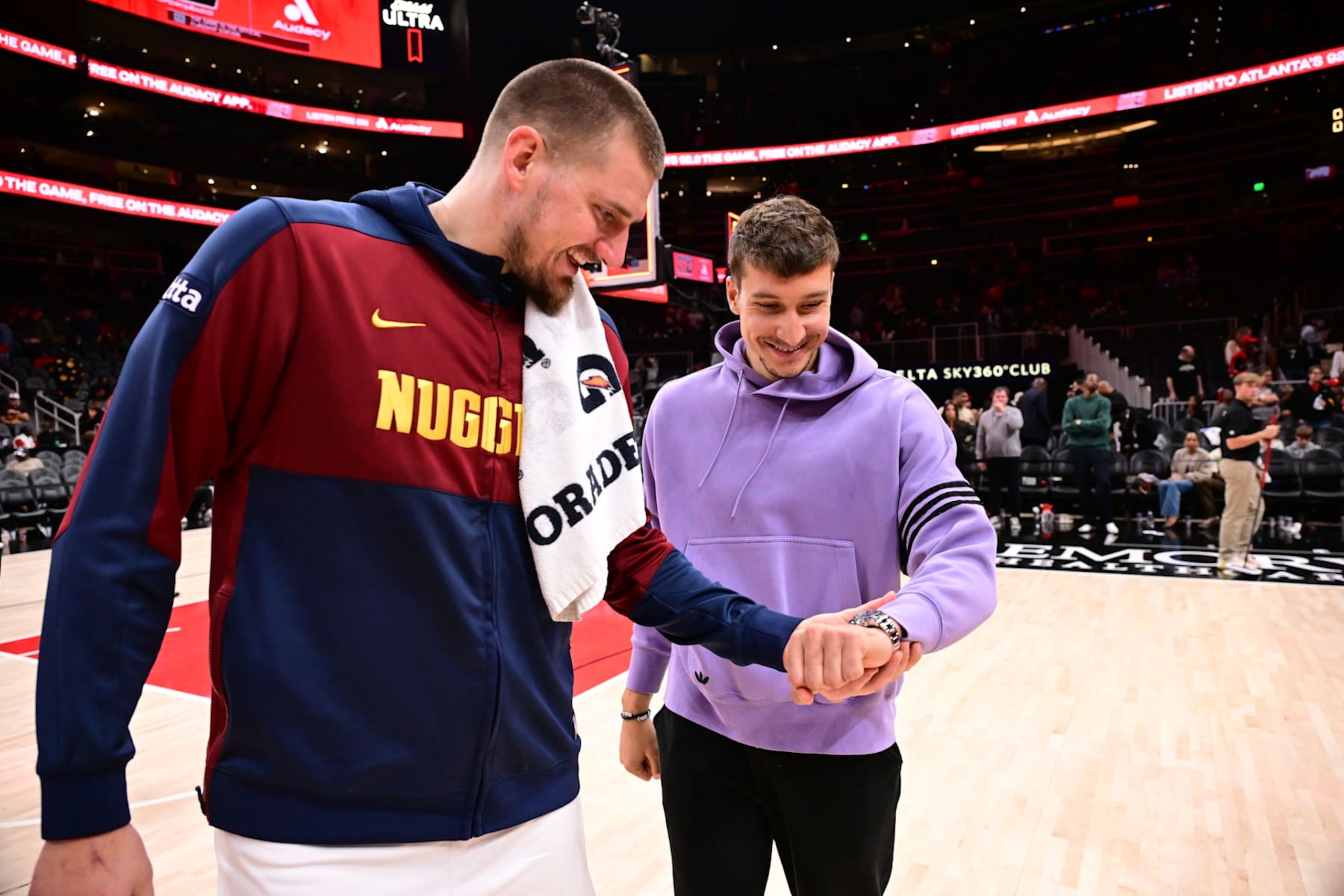 ATLANTA, GA - DECEMBER 8: Nikola Jokic #15 of the Denver Nuggets and Bogdan Bogdanovic #13 of the Atlanta Hawks talk after the game on December 8, 2024 at State Farm Arena in Atlanta, Georgia.  NOTE TO USER: User expressly acknowledges and agrees that, by downloading and/or using this Photograph, user is consenting to the terms and conditions of the Getty Images License Agreement. Mandatory Copyright Notice: Copyright 2024 NBAE (Photo by Adam Hagy/NBAE via Getty Images)