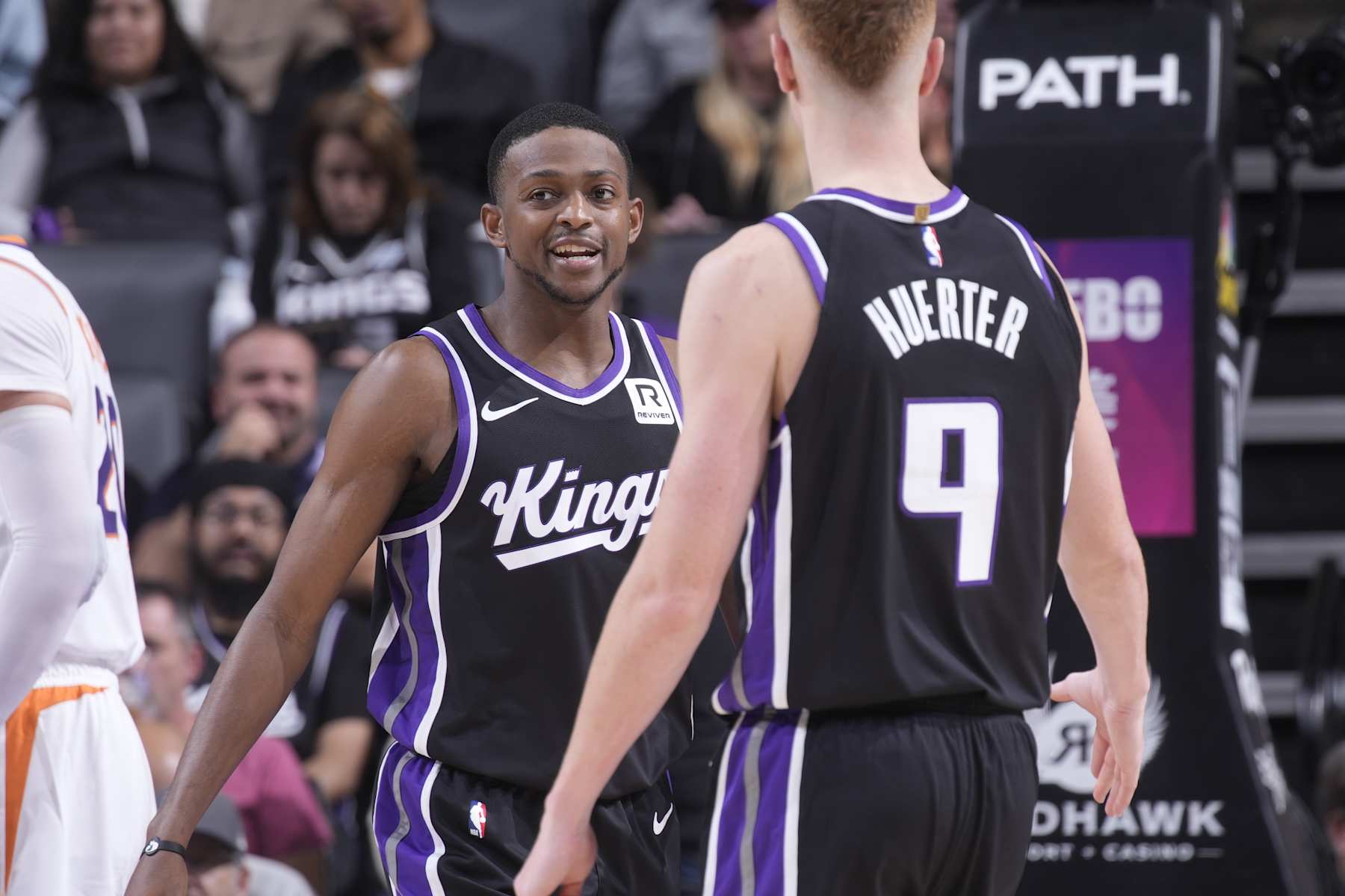 SACRAMENTO, CA - NOVEMBER 13: De'Aaron Fox #5 and Kevin Huerter #9 of the Sacramento Kings talk during the game against the Phoenix Suns on November 13, 2024 at Golden 1 Center in Sacramento, California. NOTE TO USER: User expressly acknowledges and agrees that, by downloading and or using this photograph, User is consenting to the terms and conditions of the Getty Images Agreement. Mandatory Copyright Notice: Copyright 2024 NBAE (Photo by Rocky Widner/NBAE via Getty Images)